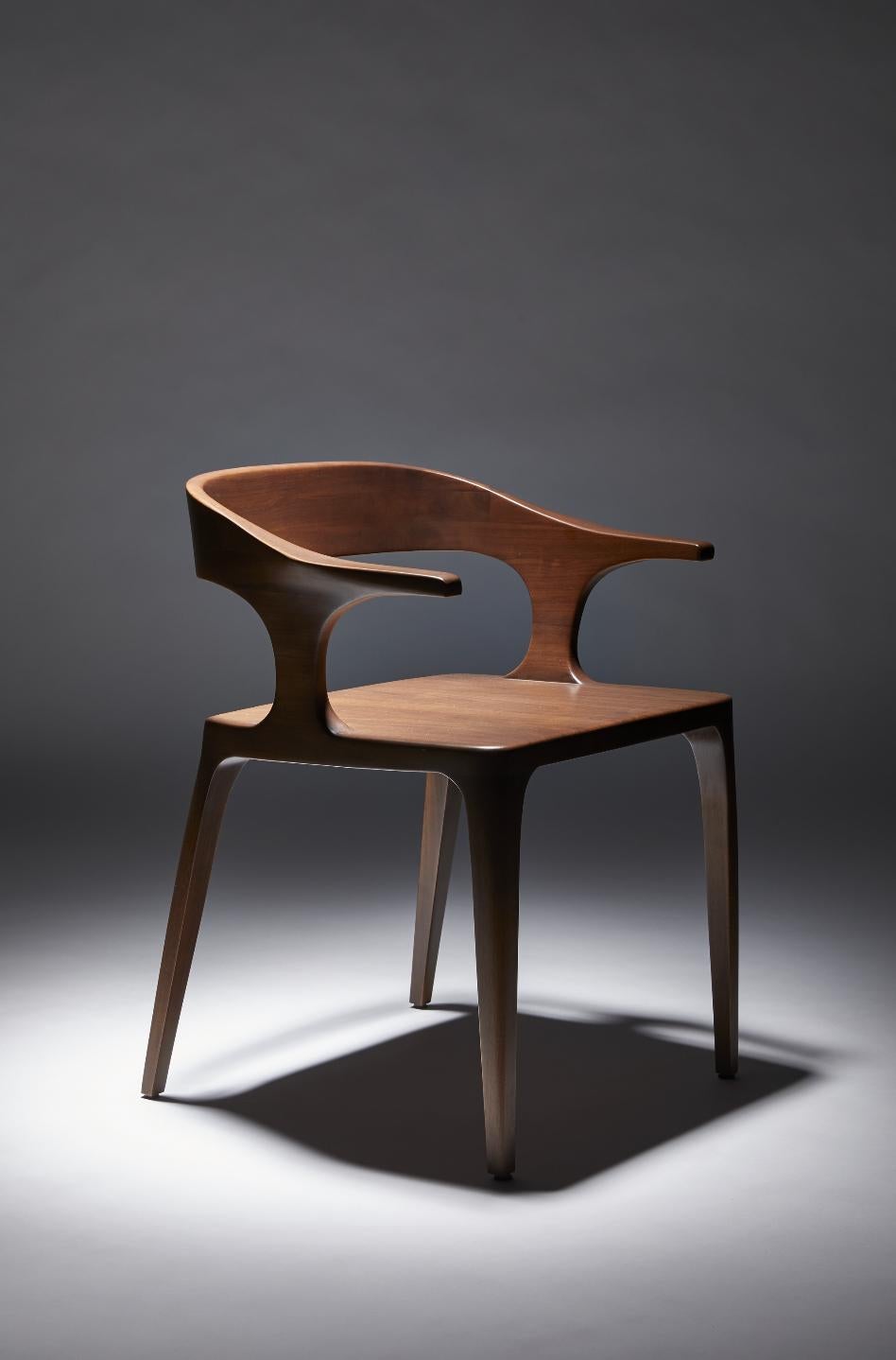 Confortable dining chair. In Walnut but can be ordered in Oak or Blackened Oak wood. Oil finish

If fineness had to be incarnated by one object, without hesitation the Eileen
Chair would be it. A particular base, with a disturbing sensuality.
