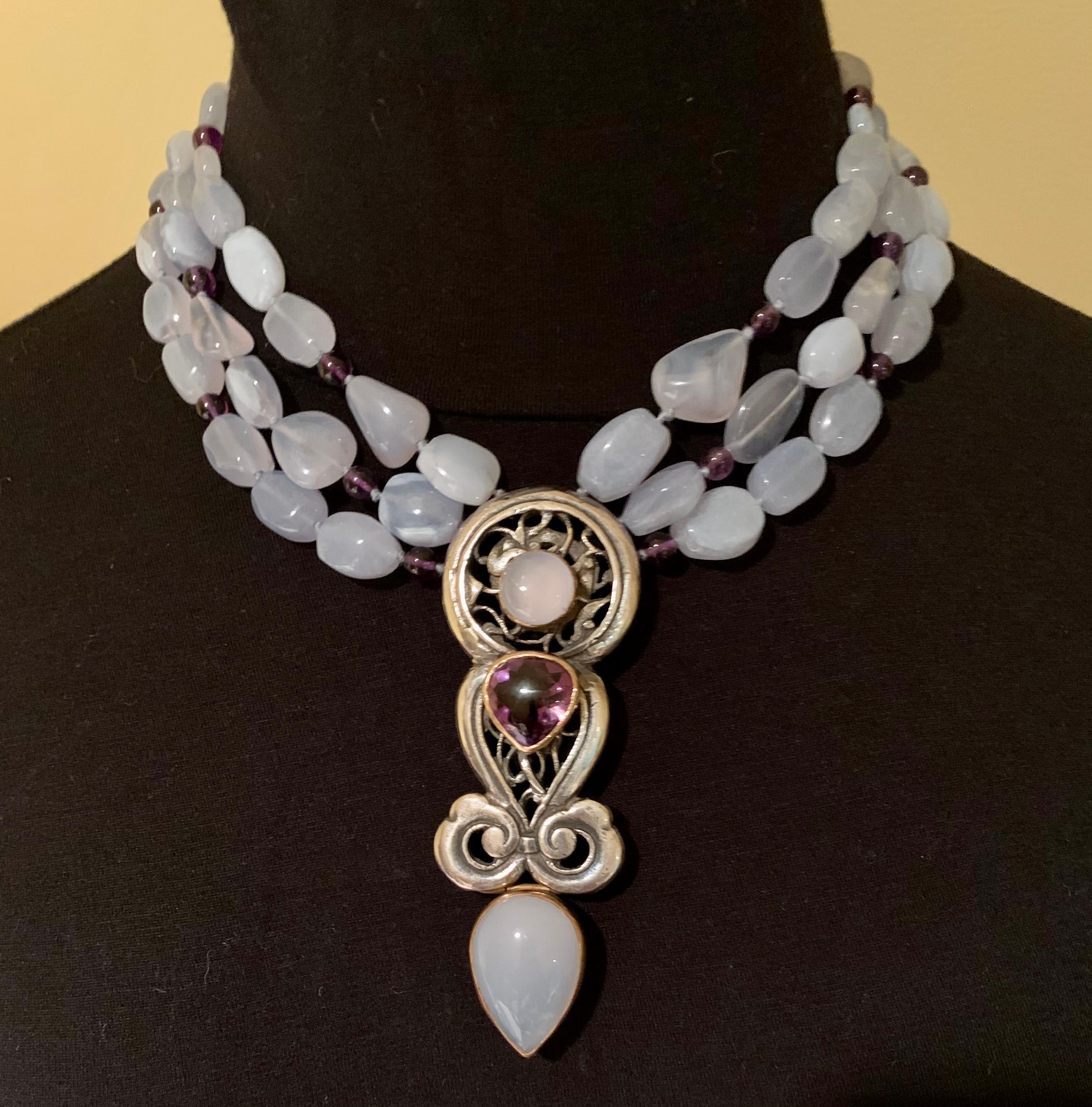 Eileen Coyne necklaces have graced the necks of stylish women such as Princess Ira von Furstenberg, Shirley Conran and Princess Michael of Kent. Often one of a kind, each jewel is designed by the artist. This stunning blue calcedony, amethyst, 22K