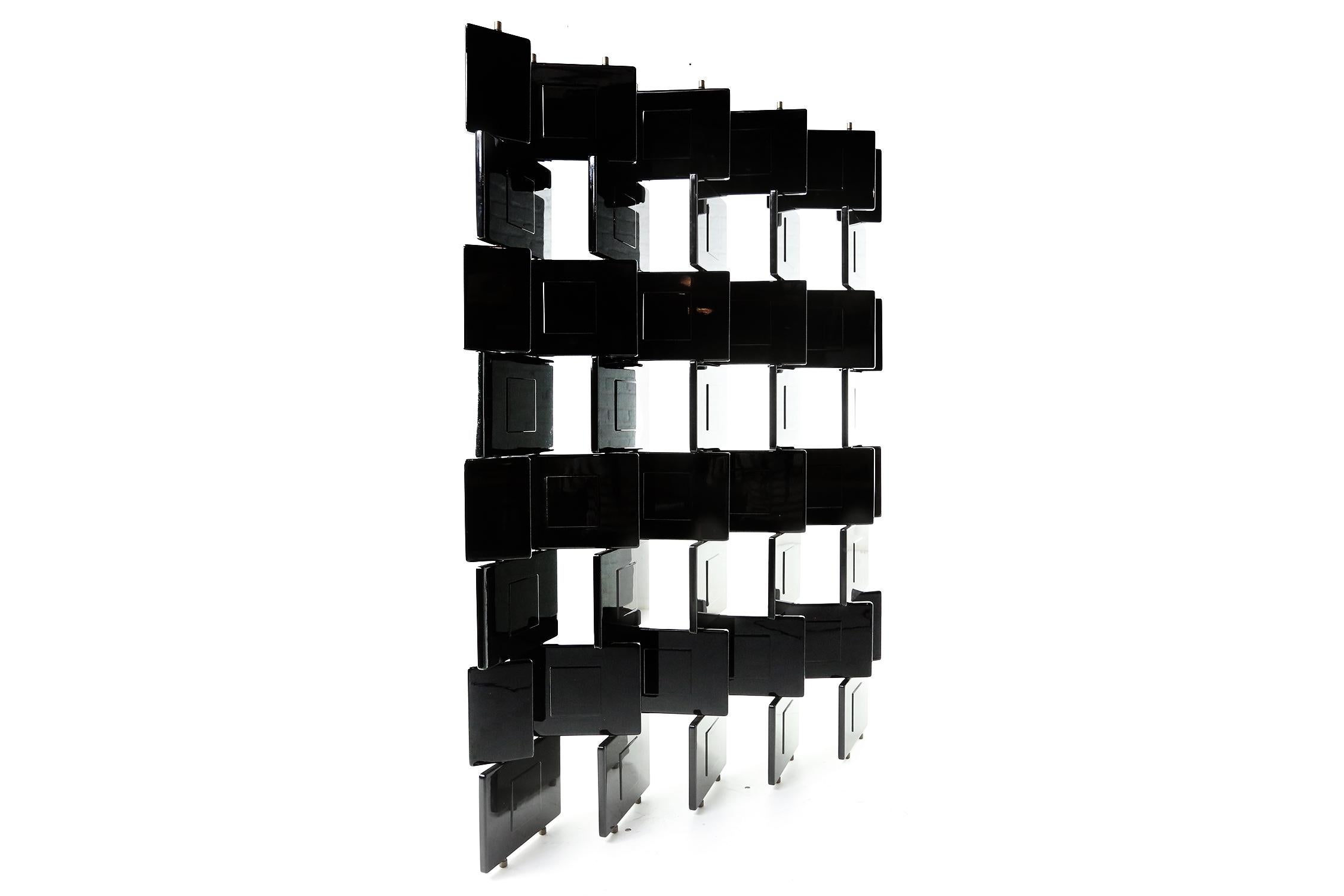 Eileen gray block screen room divider, made by 'Architects Italy' in the 1990s,
Its made in black lacquered wood moveable panels and brass structure.