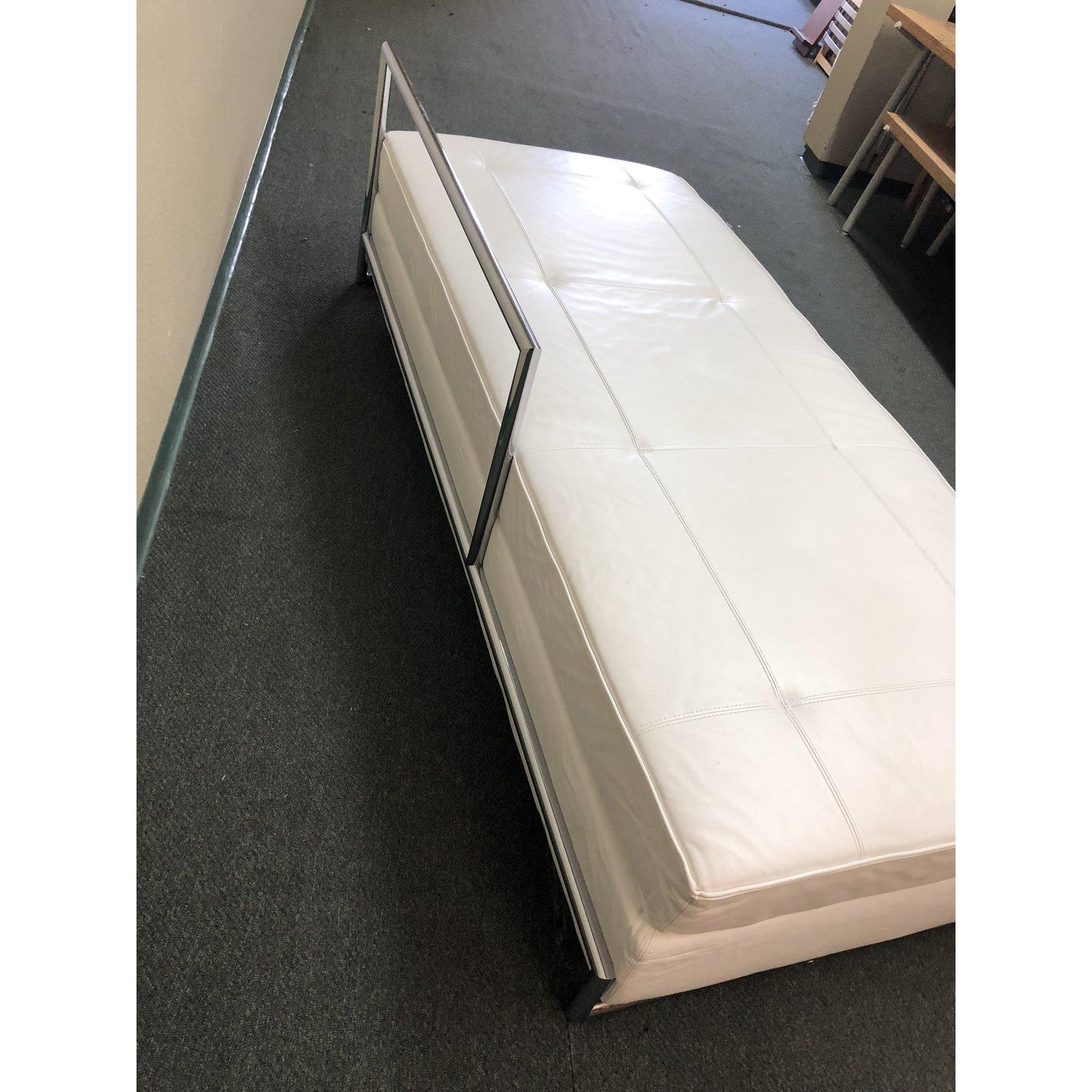 An Eileen Gray daybed. This beautiful piece is upholstered in white leather and the base is chromium plated steel tubing. Eileen Gray designed the daybed in 1925 and since then it is counted among the most famous products by her. Daybed is made by