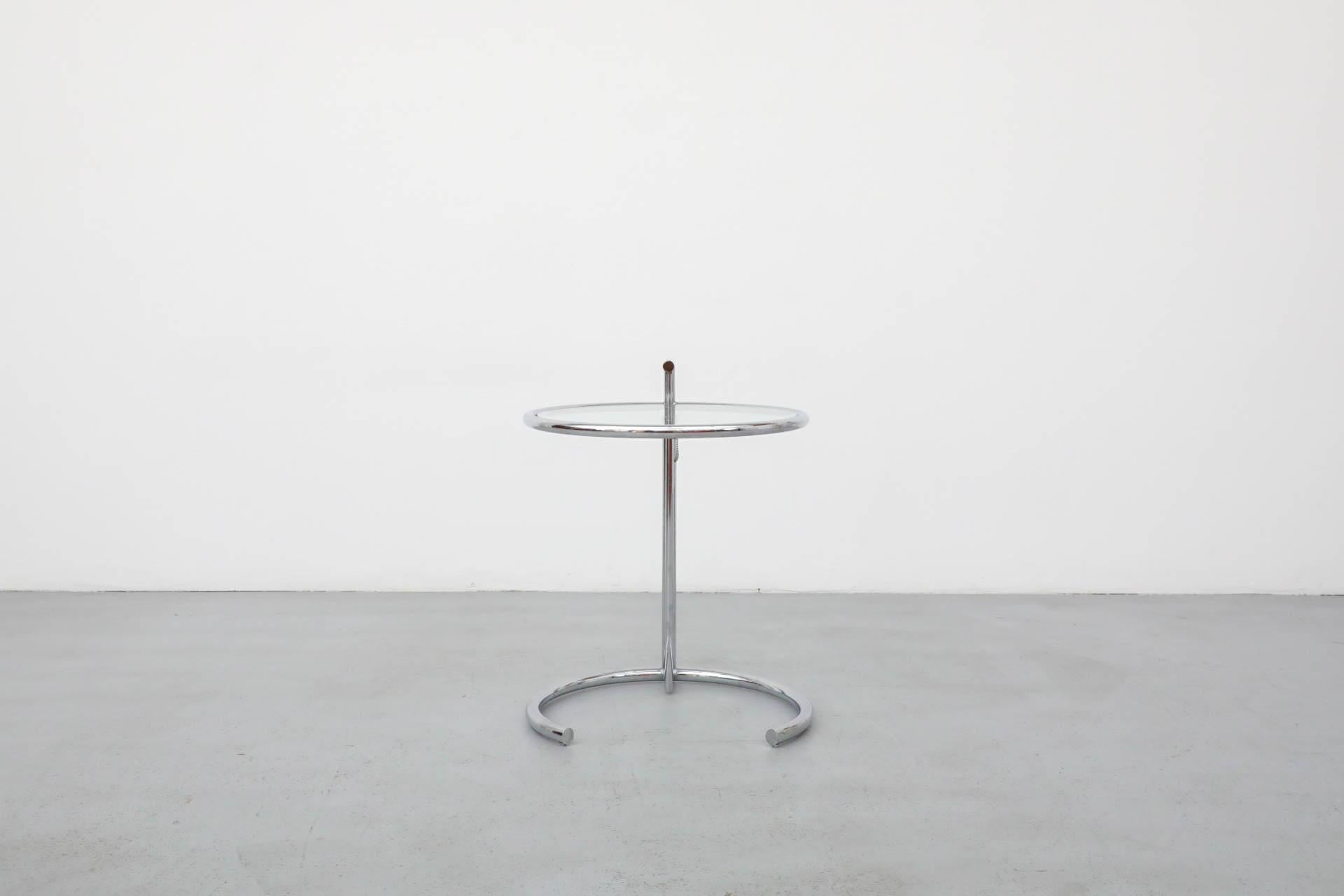 This height-adjustable chrome side table with glass top is named after the modernist E1027 villa in Roquebrune-Cap-Martin, France, for which it was designed by Eileen Gray, the villa's architect. Intended for Gray’s sister with the intended purpose