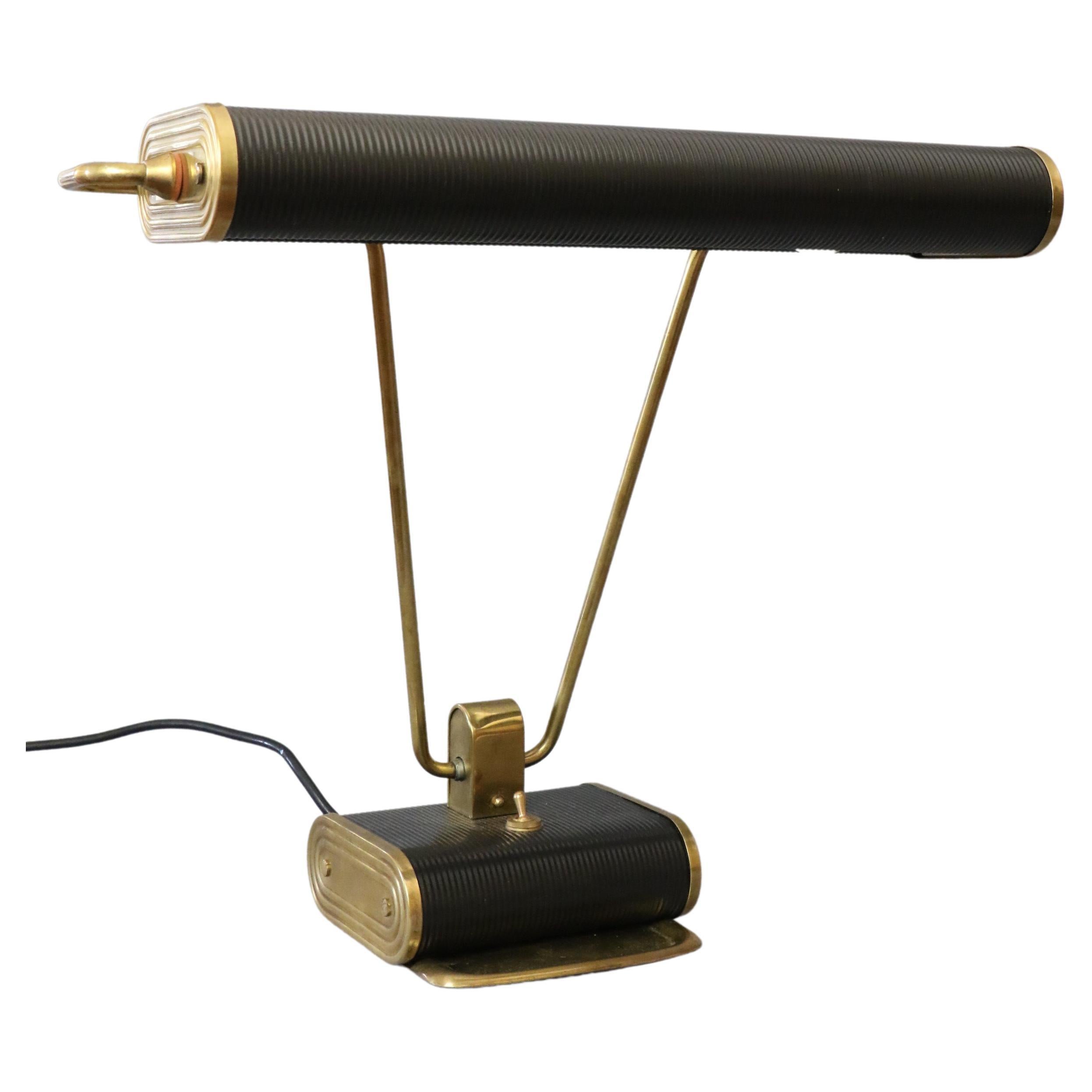 Eileen Gray midcentury desk lamp for Jumo era Corbusier Perriand, 1950s

Iconic model of the House Jumo, it is the model n°71 first edition circa 1950. It is attributed to the Irish designer Eileen Gray.
The lamp is in black lacquered folded sheet