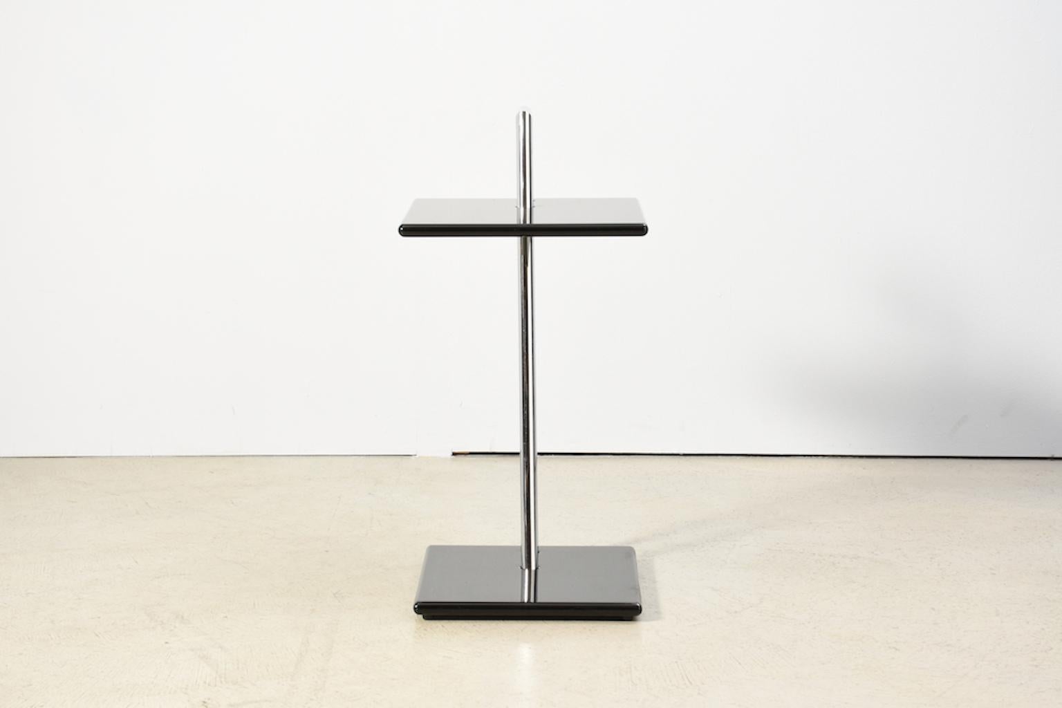 Side table by Eileen Gray. Chrome steel and wood glossy lacquered in black. Version from the 1970s. Produced in Venice / Italy. This version is much bigger than the version made today by Classicon.
Upper shelf 35x40 cm
Lower shelf 32x35 cm
Total
