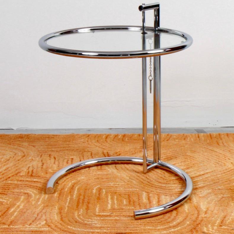 Purchased at Design Within Reach around 2005, this Eileen Gray table is in near perfect condition. The table is an adjustable steel and glass table was designed by Gray in 1927. Originally created for her E-1027 house, the table has since become one