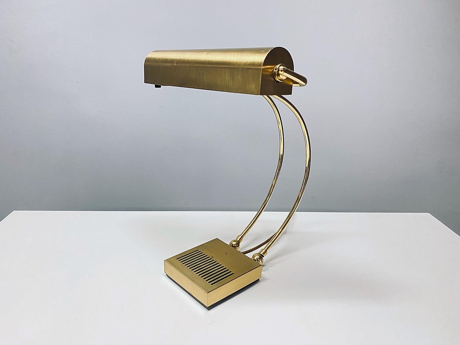Beautiful adjustable table lamp in style of Eileen Gray manufactured in 1970s, Germany. The lamp is made of polished brass. The lamp provides a smooth and wonderful light. The lamp is in a very good original condition, fully working and tested. One