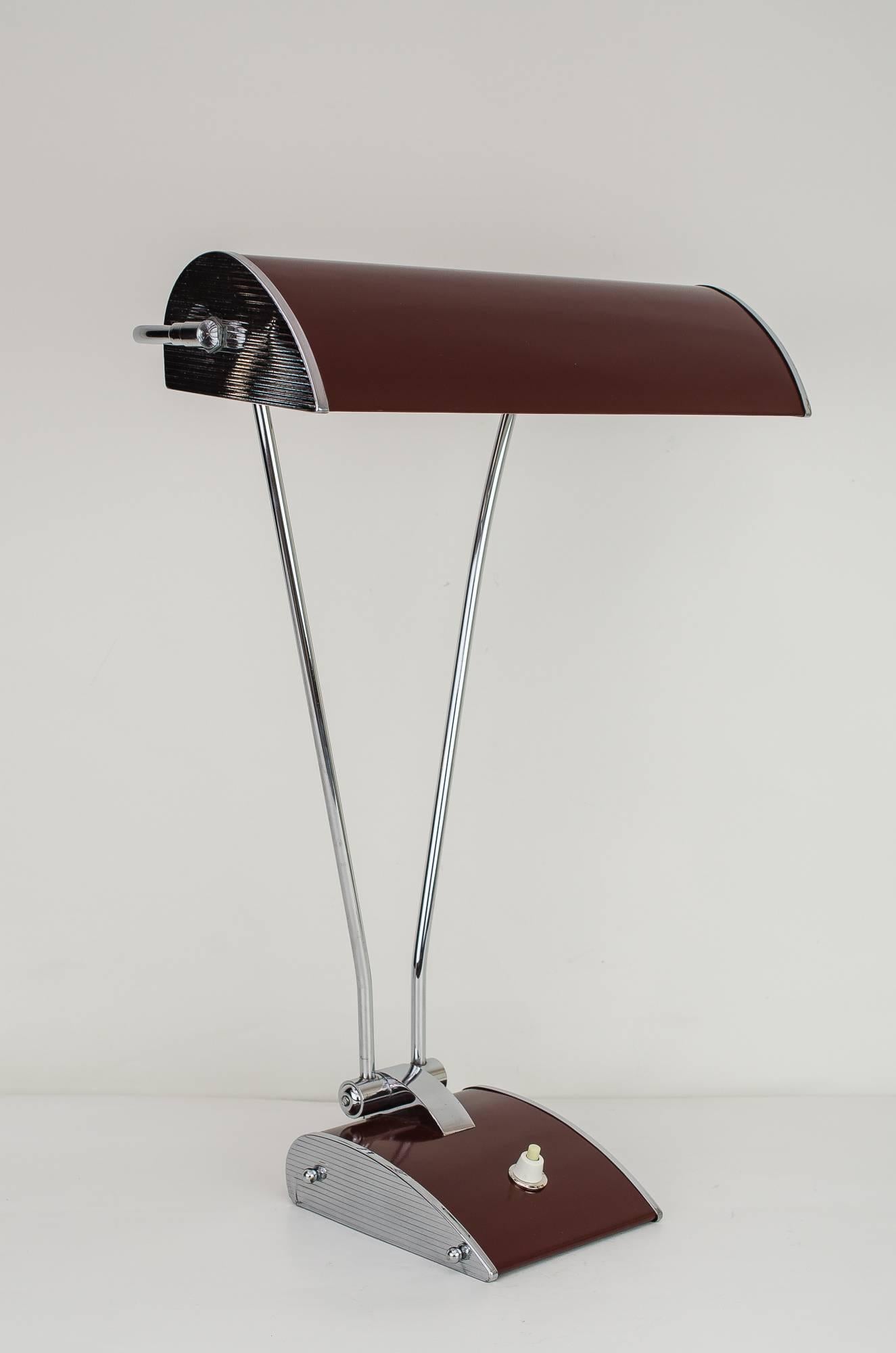 Eileen Gray table lamp for Jumo, 1955.
Table lamp, 1945-1950, made of chrome-plated metal
Original condition.

 