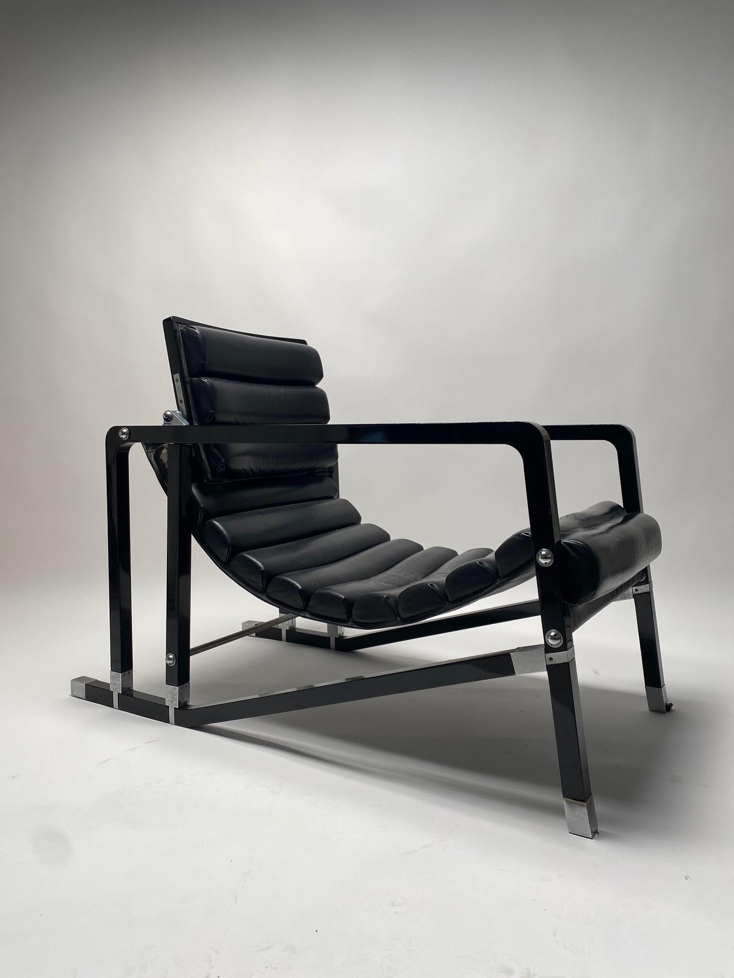 Eileen Grey, Black leather lounge chair, model Transat, 1970s. 
Black lacquered wood, brushed metal, black leather.