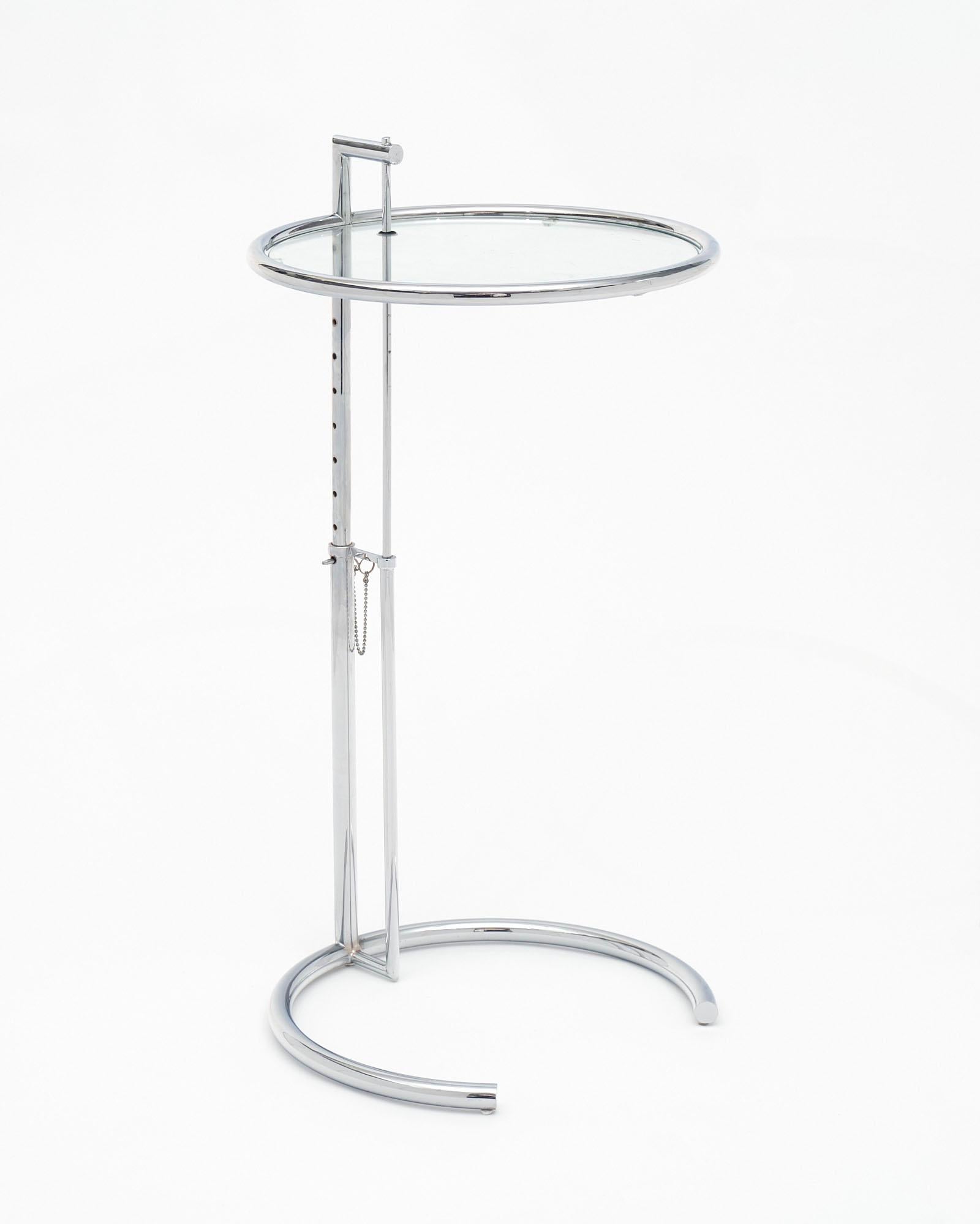 This iconic adjustable side table was designed by Irish designer Eileen Gray in 1927. Table E 1027 is an adjustable steel and glass. Originally created for her E-1027 house; the table has since become one of Gray's most famous designs. The table's