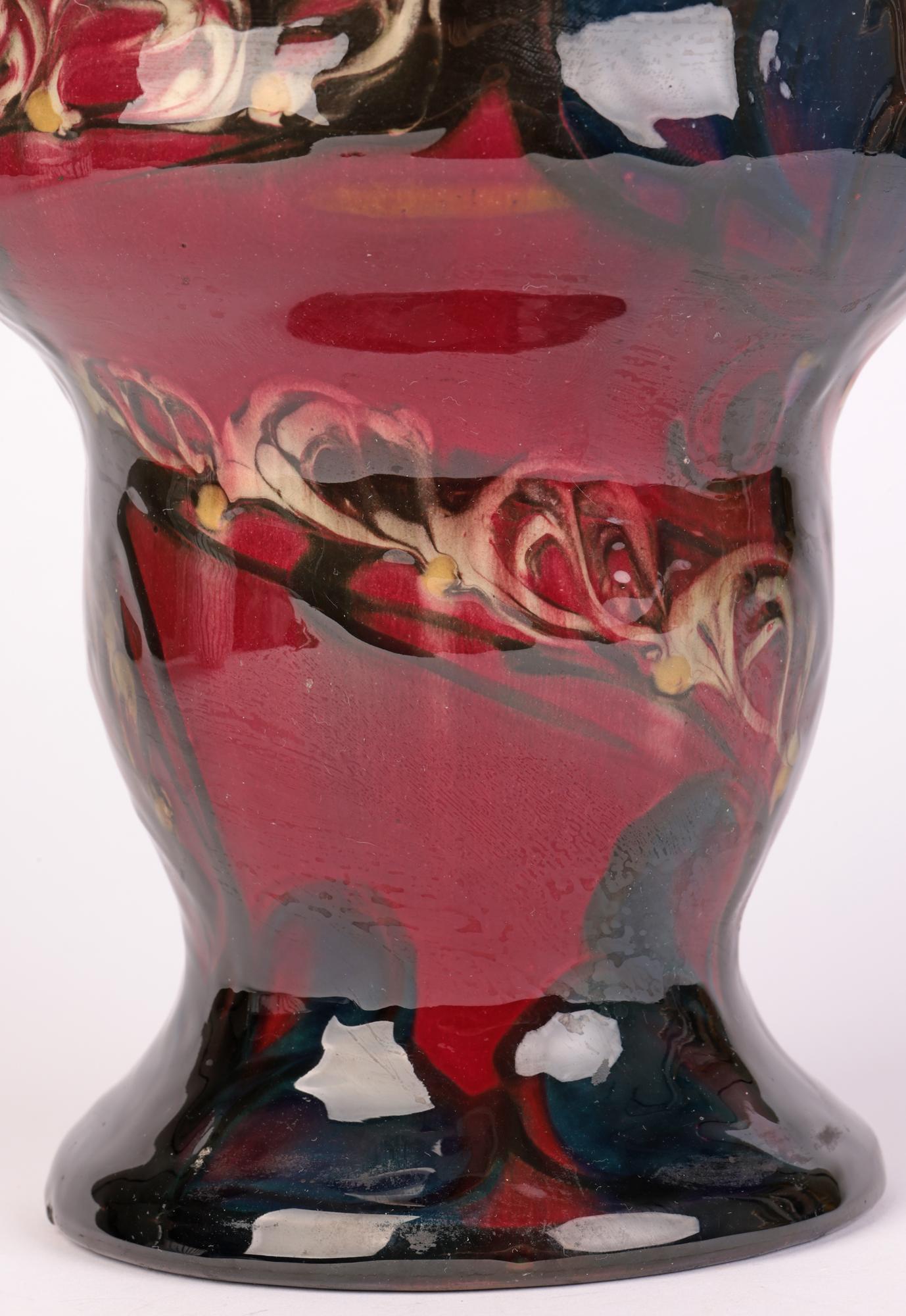 An exceptional and scarce Danish Art Nouveau abstract stylized floral decorated vase by Eiler Londal for Danico and dating between 1900 and 1929 believed to be an early example. This stylish and unusual shaped vase stands on a wide skirted with a