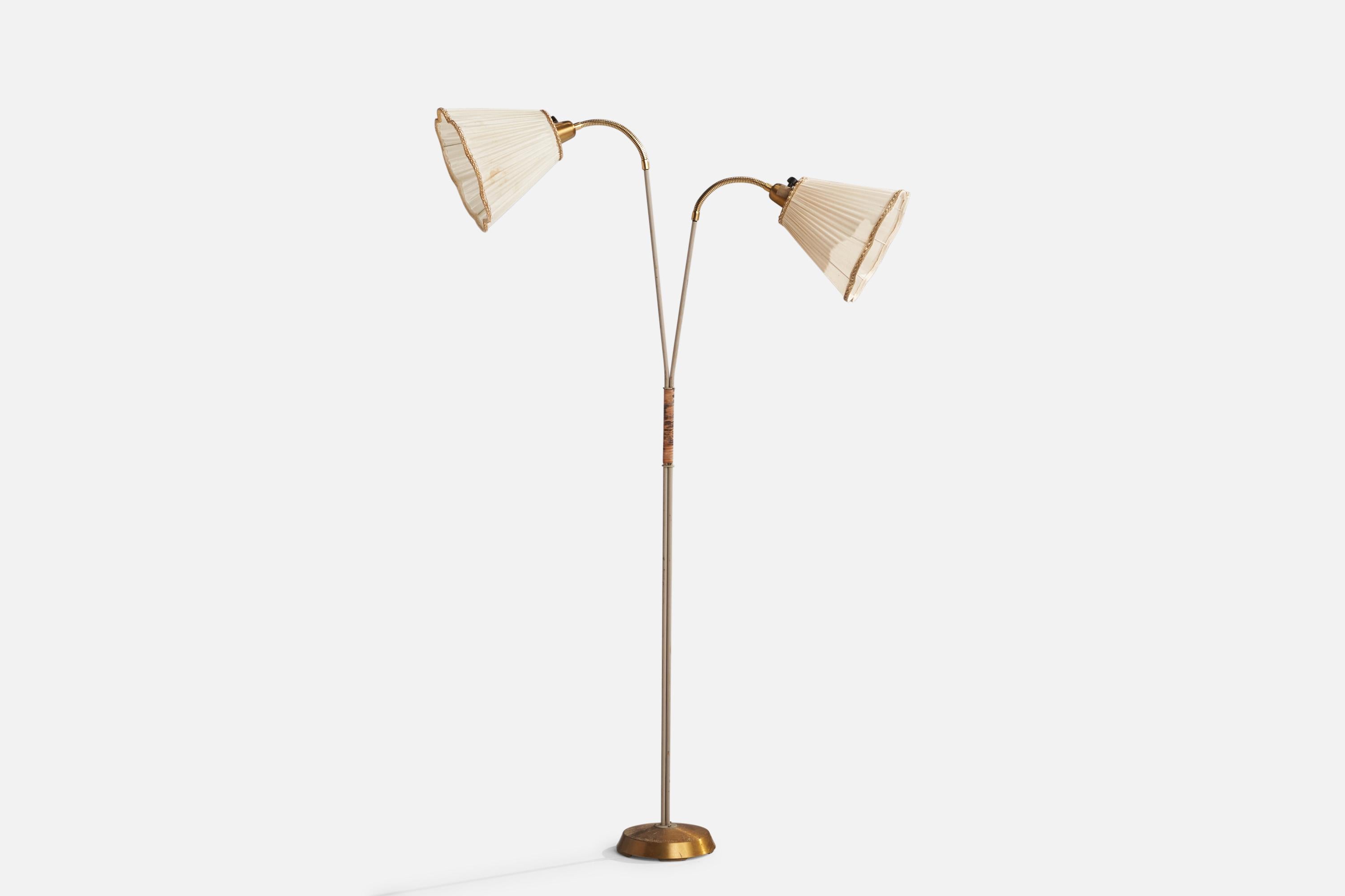 An adjustable two-armed brass, grey-lacquered metal, rattan and fabric floor lamp designed and produced by Einar Bäckström, Sweden, 1950s.

Dimension variable

Overall Dimensions (inches): 62”  H x 32”  W x 15” D
Stated dimensions include