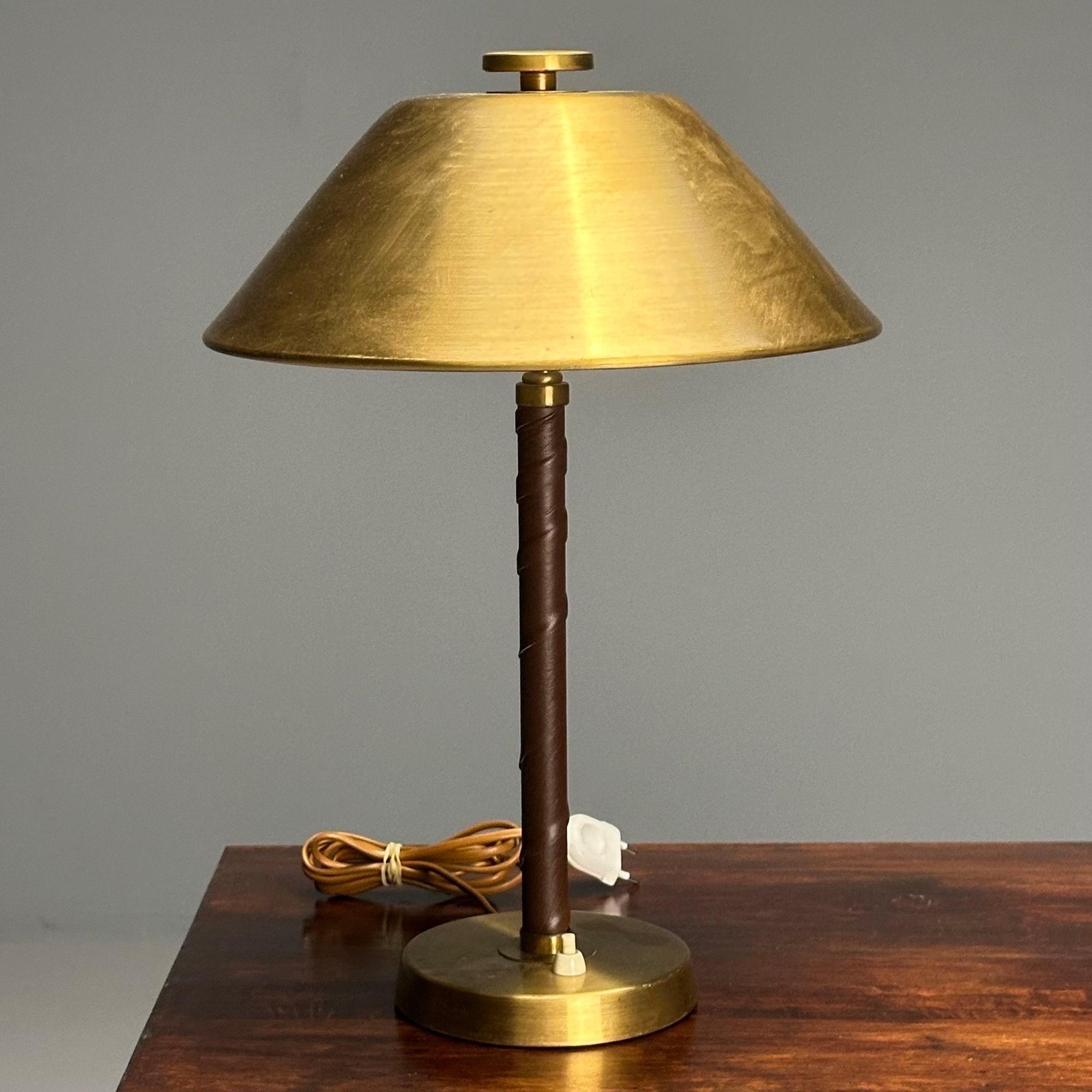 Einar Bäckström, Swedish Mid-Century Modern, Table Lamps, Leather, Brass, 1940s

Swedish modern brass and leather-wrapped table or desk lamp designed by Einar Backstrom in Sweden circa 1940s. Marked 'EB Made in Sweden 5014'.

Brass, Leather
Sweden,