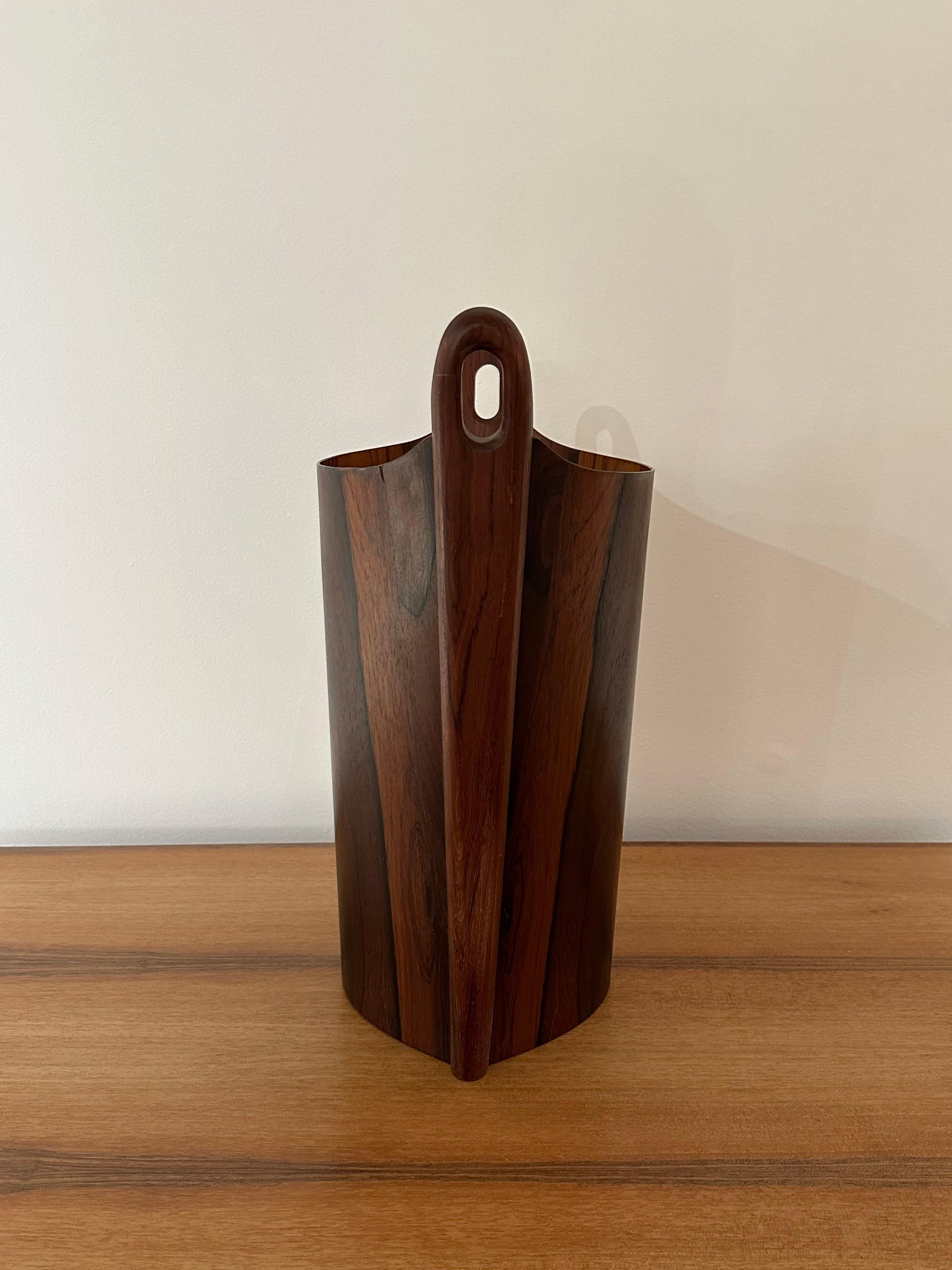 Danish modern waste can, designed by Einar Barnes for P.S. Heggen, Norway, circa 1960s. Rich patterned rosewood. Signed with branded manufacturer's mark to the interiors [P.S. Heggen Nordfjordeid Made in Norway]. 