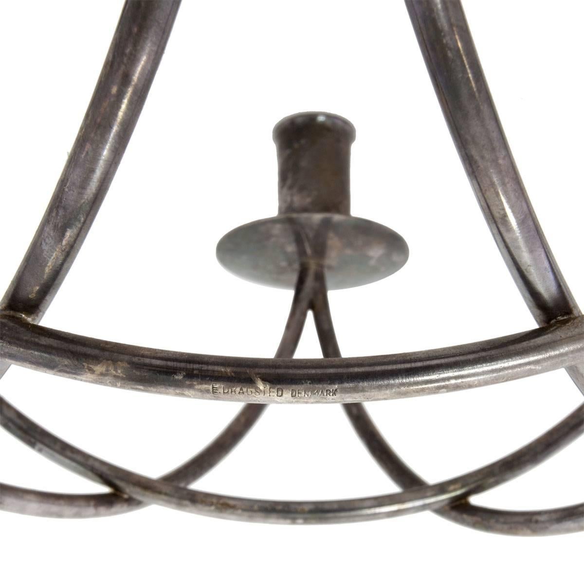 Danish mid century modern silverplated candelabrum sculpture. circa 1957 signed E. Dragsted Denmark. Dragsted goldsmiths, established in 1854, was purveyor to the danish royal family. the frame forms a six pointed (jewish star, star of David)
The