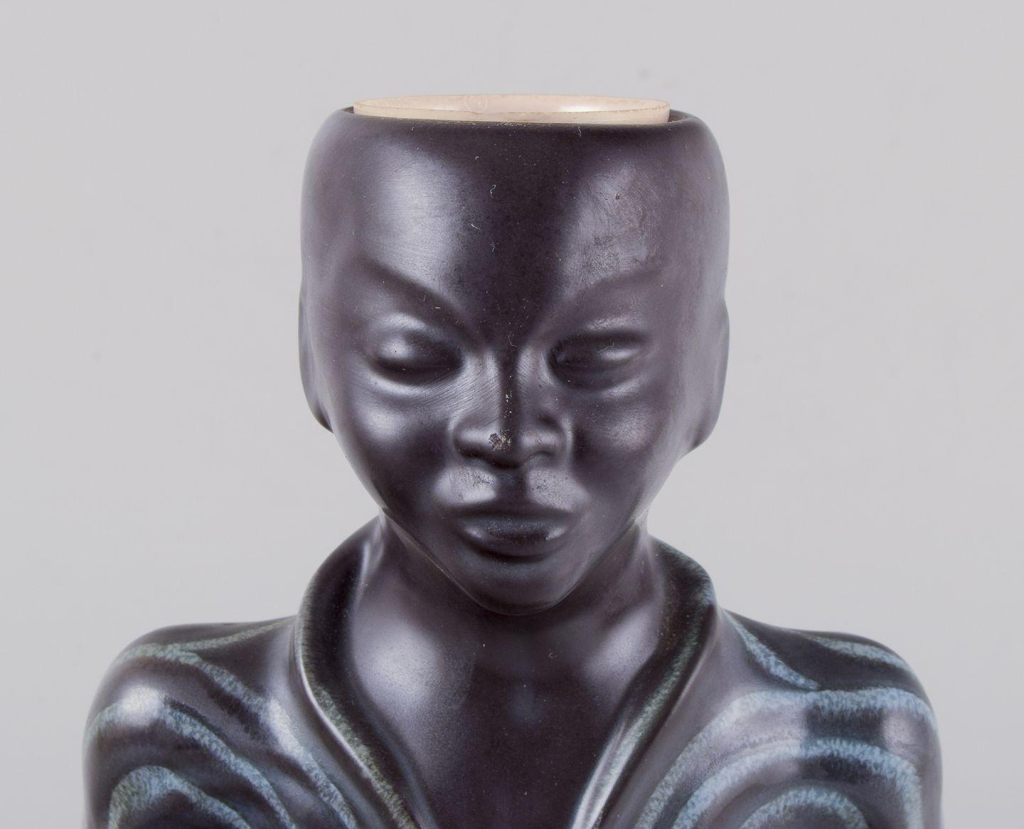 Pre-owned goods are exempt from import duties for U.S. customers. 
Therefore, no import tariffs will be applicable to your purchase.

Einar Johansen for Søholm, Danish ceramist.
Rare ceramic table lamp.
Shaped as an Asian figure in a seated