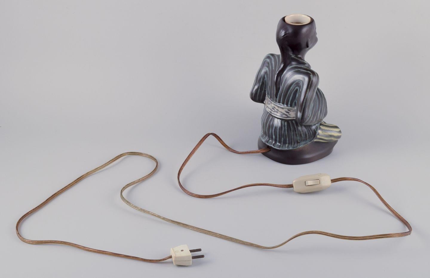 Mid-20th Century Einar Johansen for Søholm. Ceramic table lamp in the shape of Asian figure. For Sale