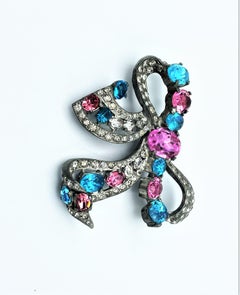 EISENBERG brooch, large bow made of rhodium with pink and aqua rhinestones, 1940