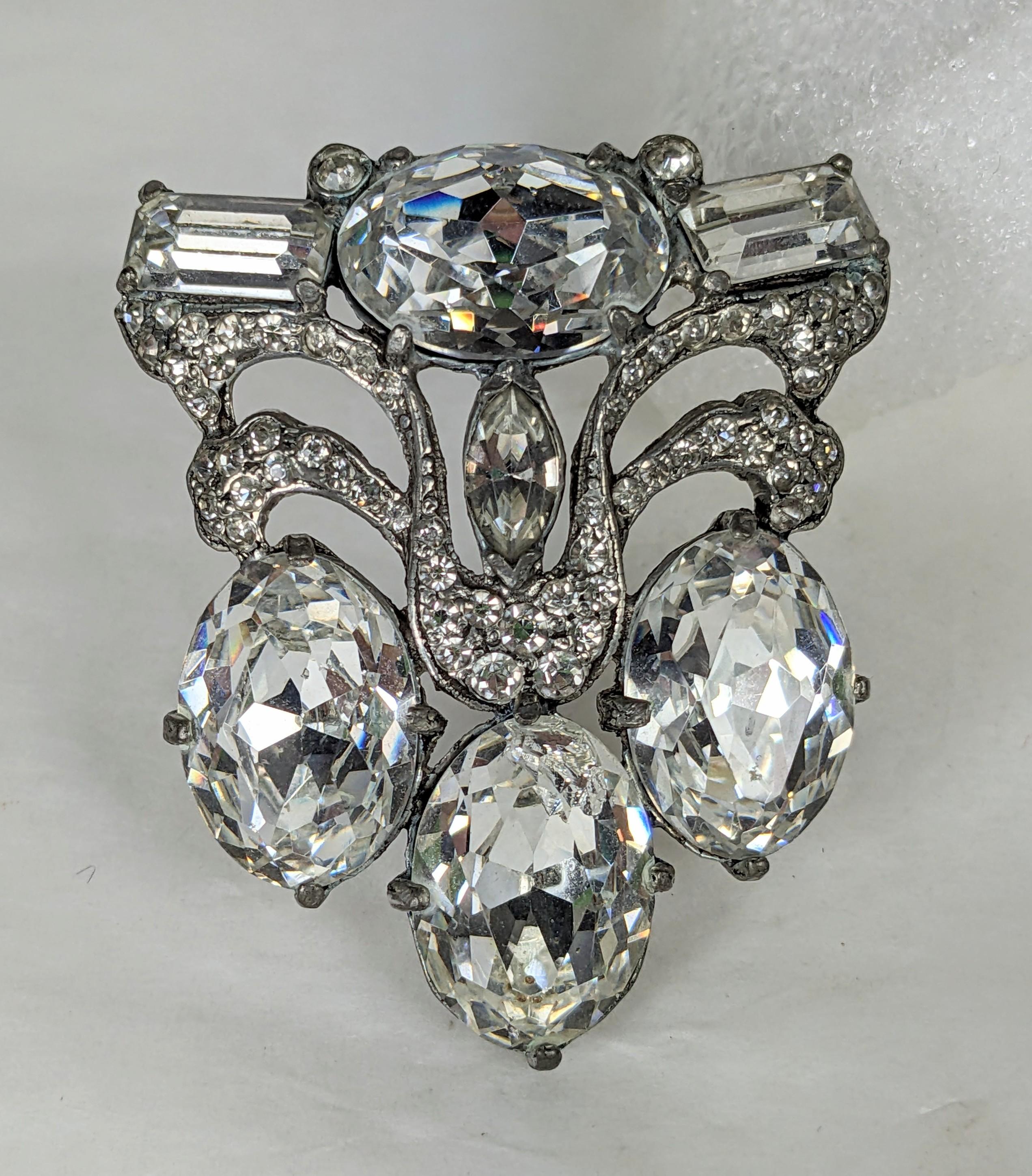 Sparkling Eisenberg Oval Crystal Dress Clip from the 1940's. These large crystals are the signatures of Eisenberg design, set in white metal with baguettes and pave accents. Unsigned 1940's USA. 
2