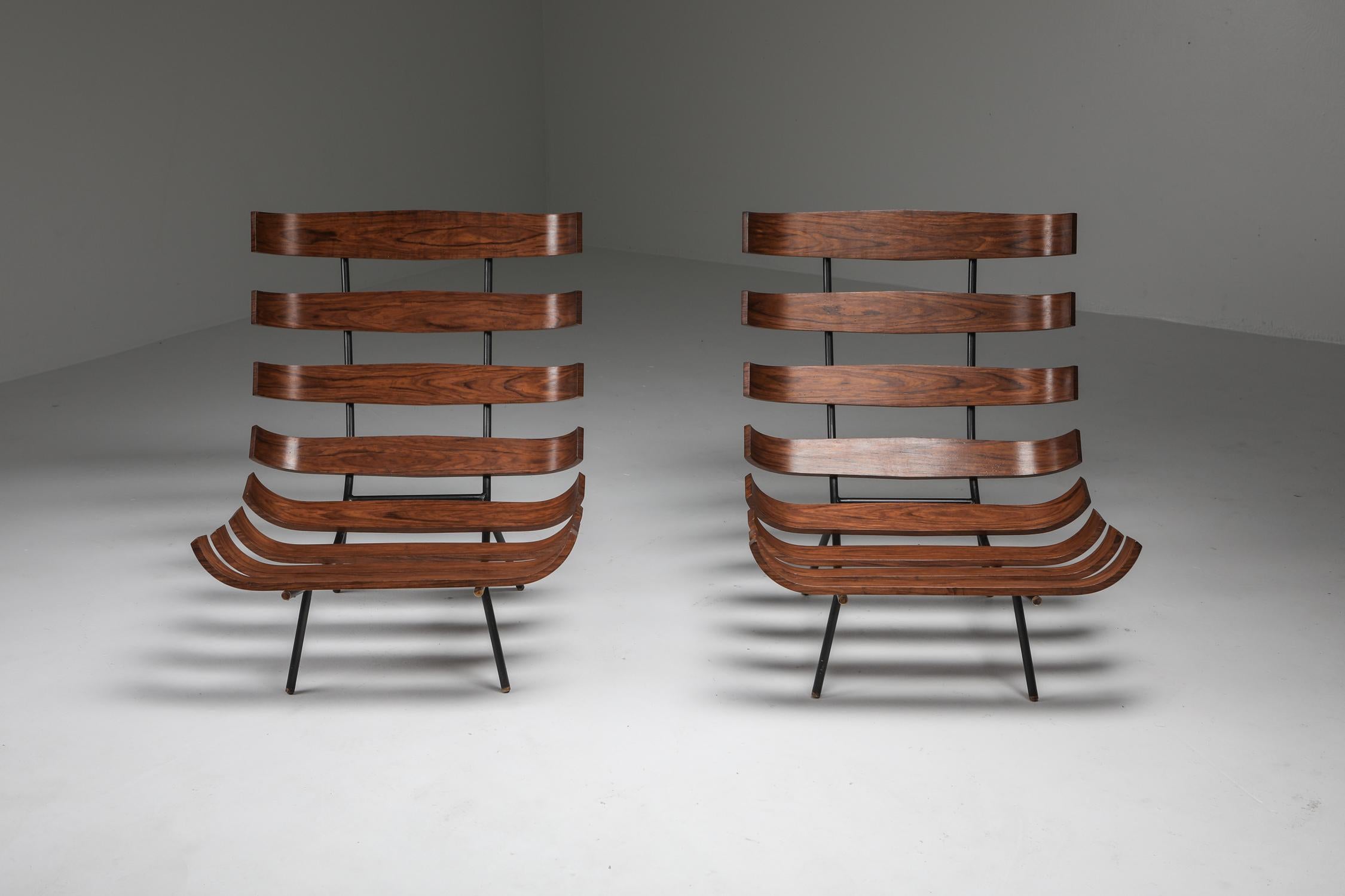 Martin Eisler & Carlo Hauner for Forma, sofa, Brazilian hardwood, metal, and fabric, Brazil, 1960s.

We can reupholster the original fabric cushions in any fabric of choice.

Pair of 'Bone' chairs by Brazilian designer duo Eisler and Hauner.