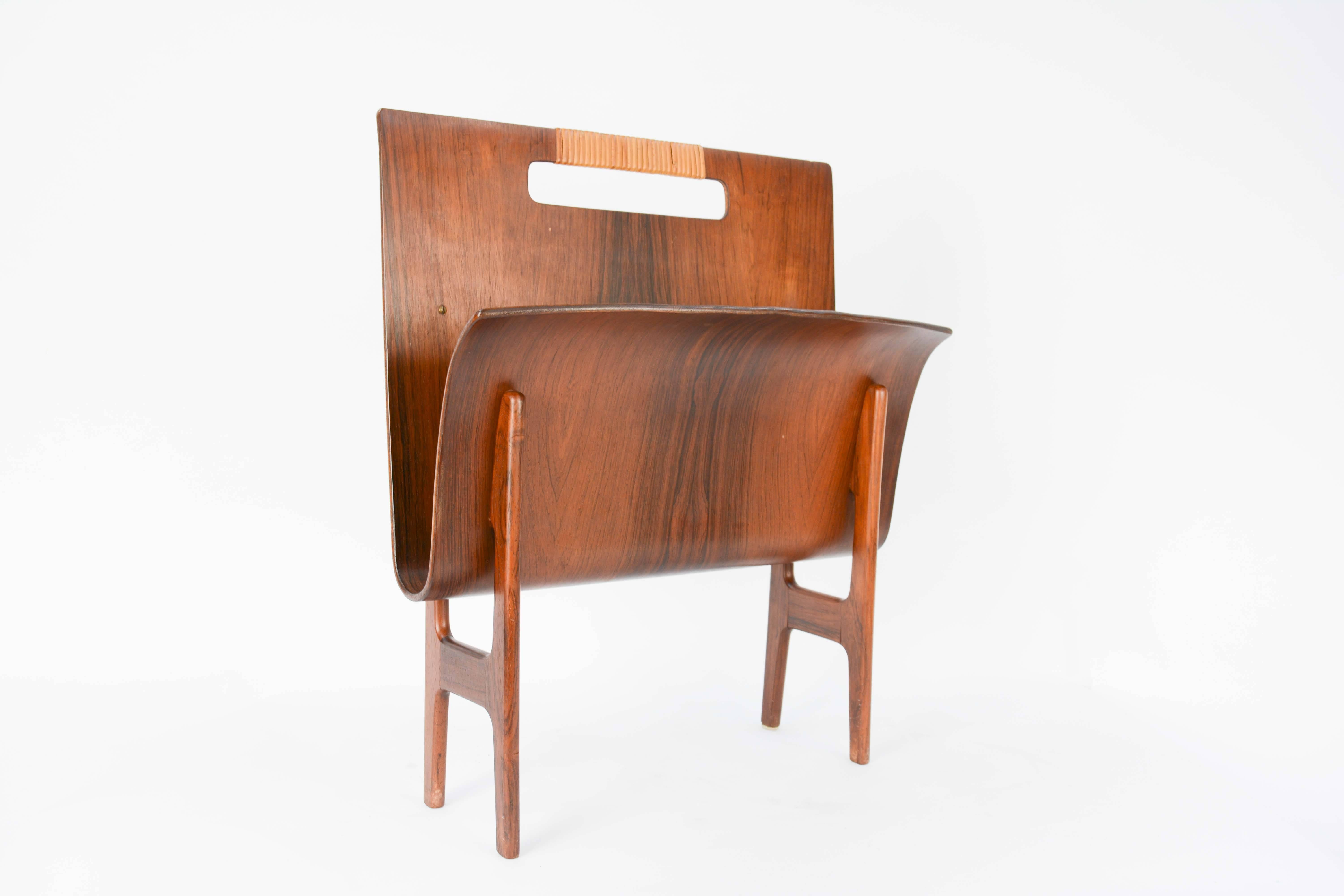 Ejnar Larsen & Axel Bender Madsen magazine stand in rosewood with a caned accented handle grip.