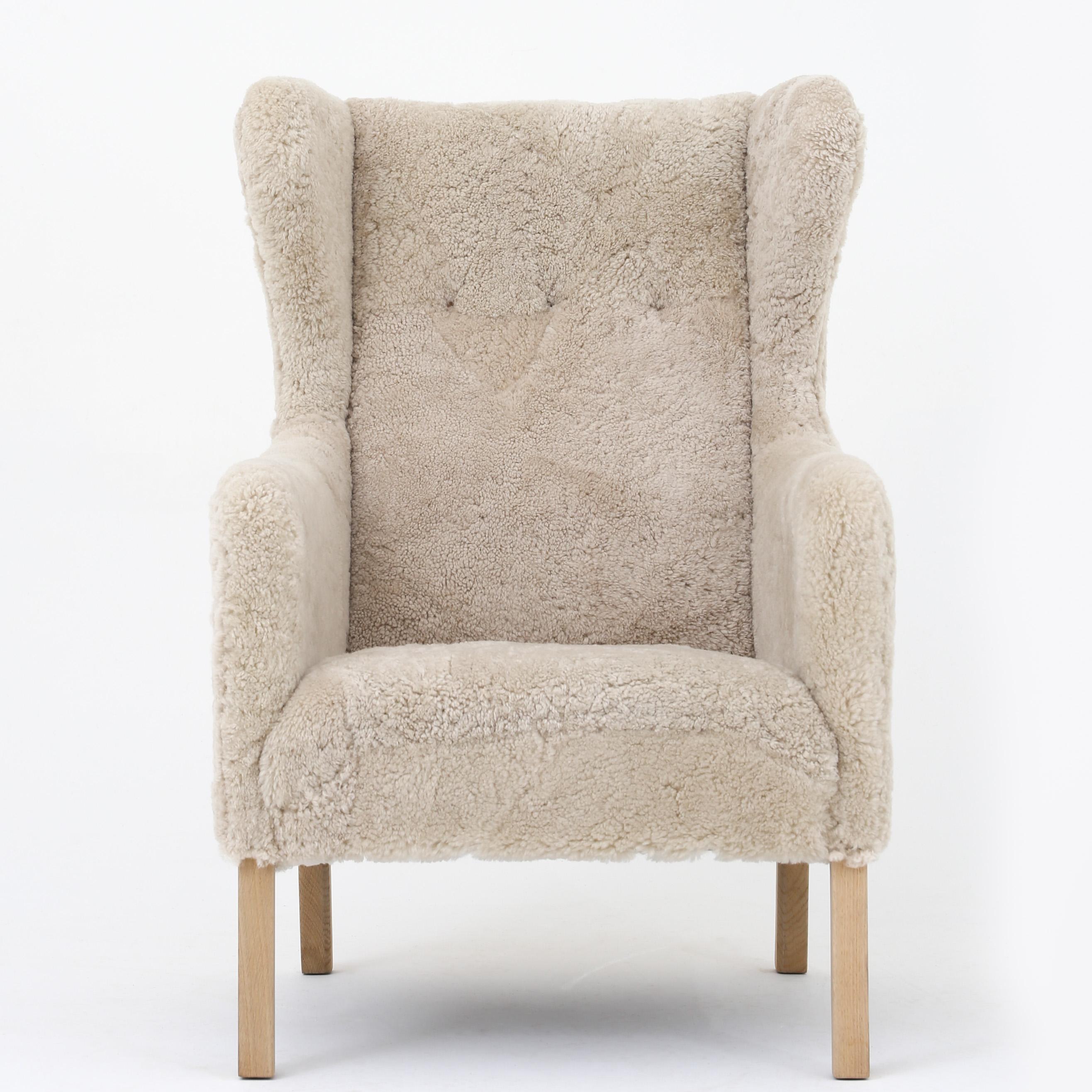 Ejnar Larsen 'Slotsholm' Wing-back chair in new lambswool with beech legs. The chair was originally designed for Christiansborg in Copenhagen.
