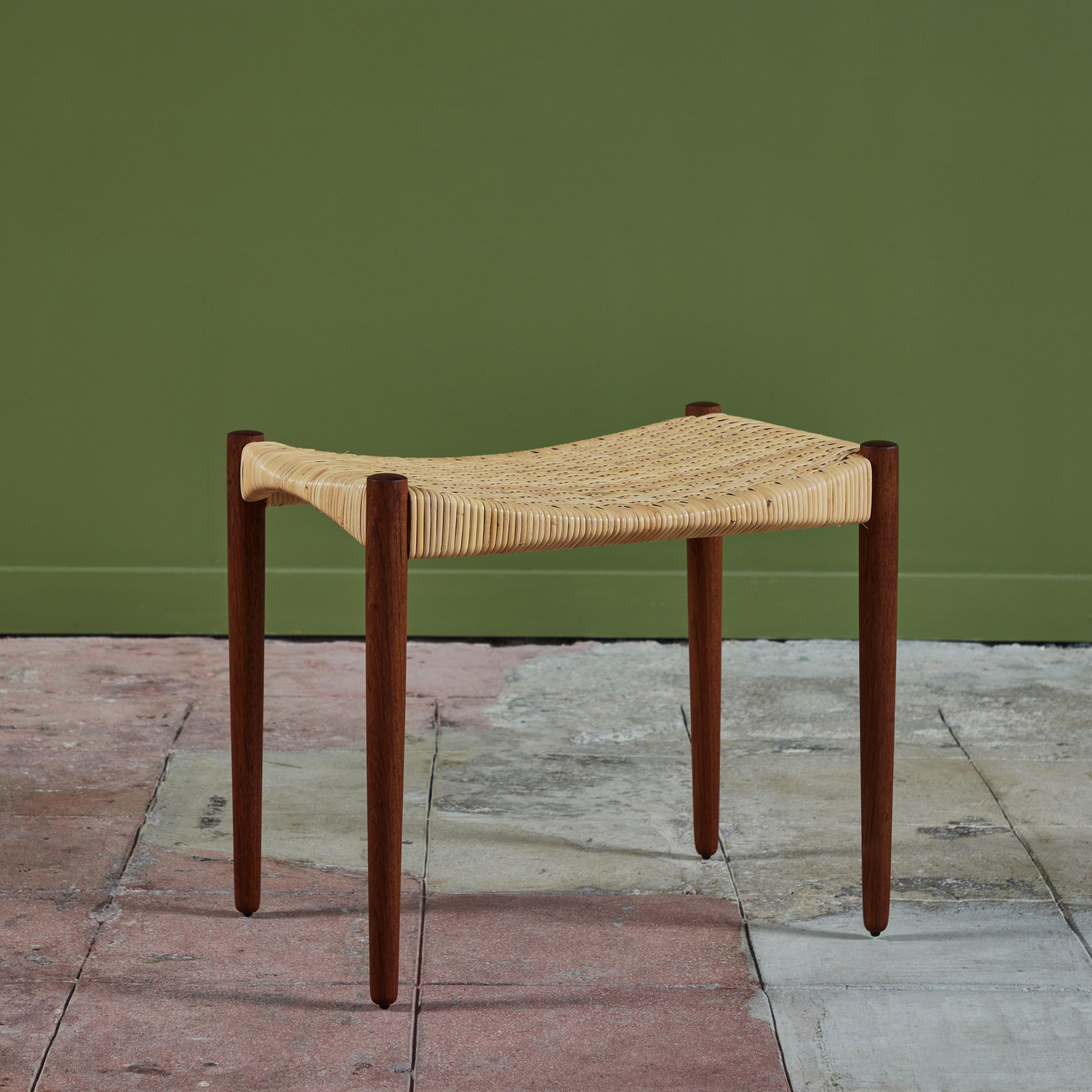 Cane stool by Ejner Larsen & Aksel Bender Madsen for Willy Beck, c.1950s, Denmark. The stool features a woven cane seat and tapered teak dowel legs.

Dimensions 
22
