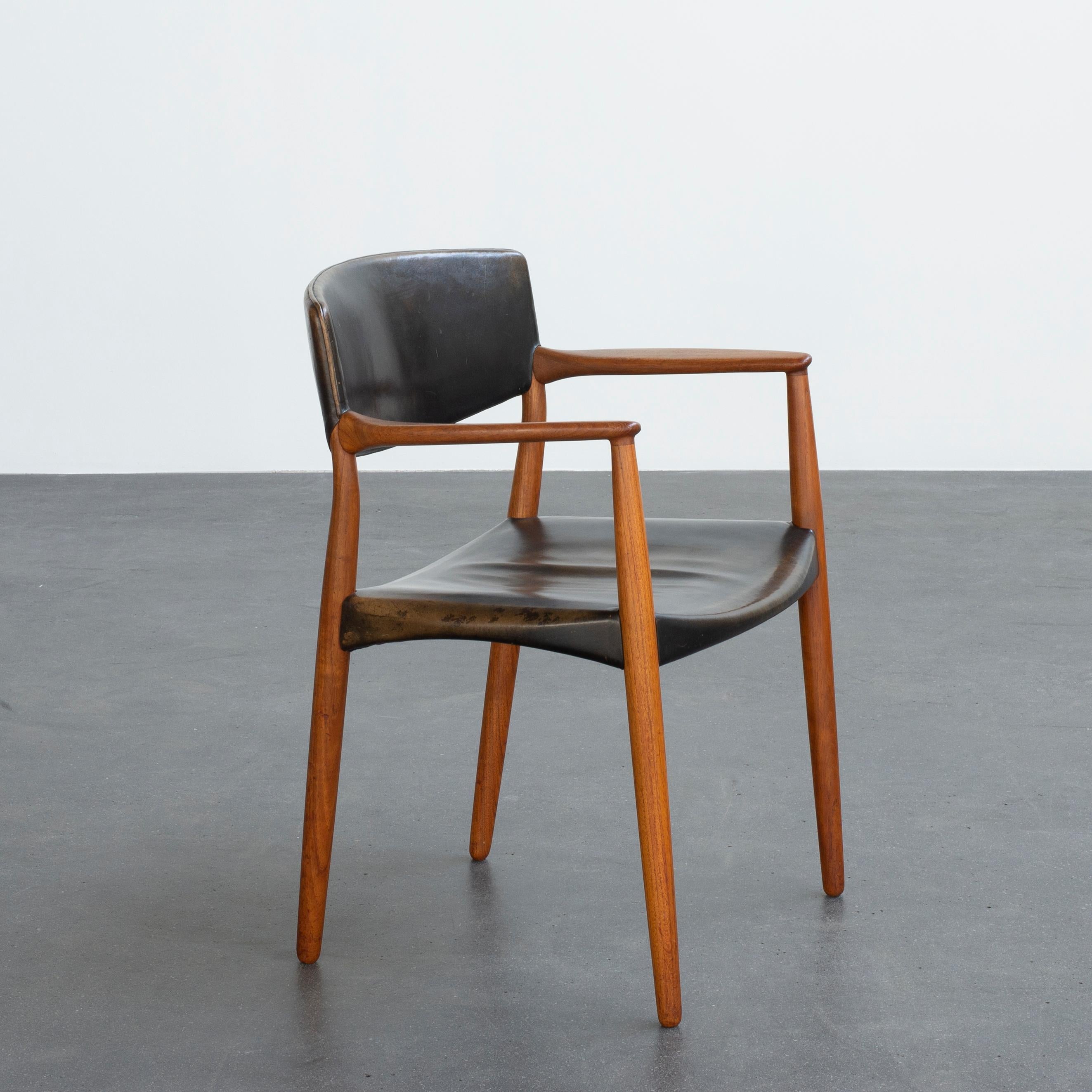 Ejner Larsen and Aksel Bender Madsen armchair. Teak and surface dyed natural tanned leather. Executed by cabinetmaker Willy Beck, Denmark. Underside with manufacturer's metal label impressed SNEDKERMESTER WILLY BECK KØBENHAVN Ø.