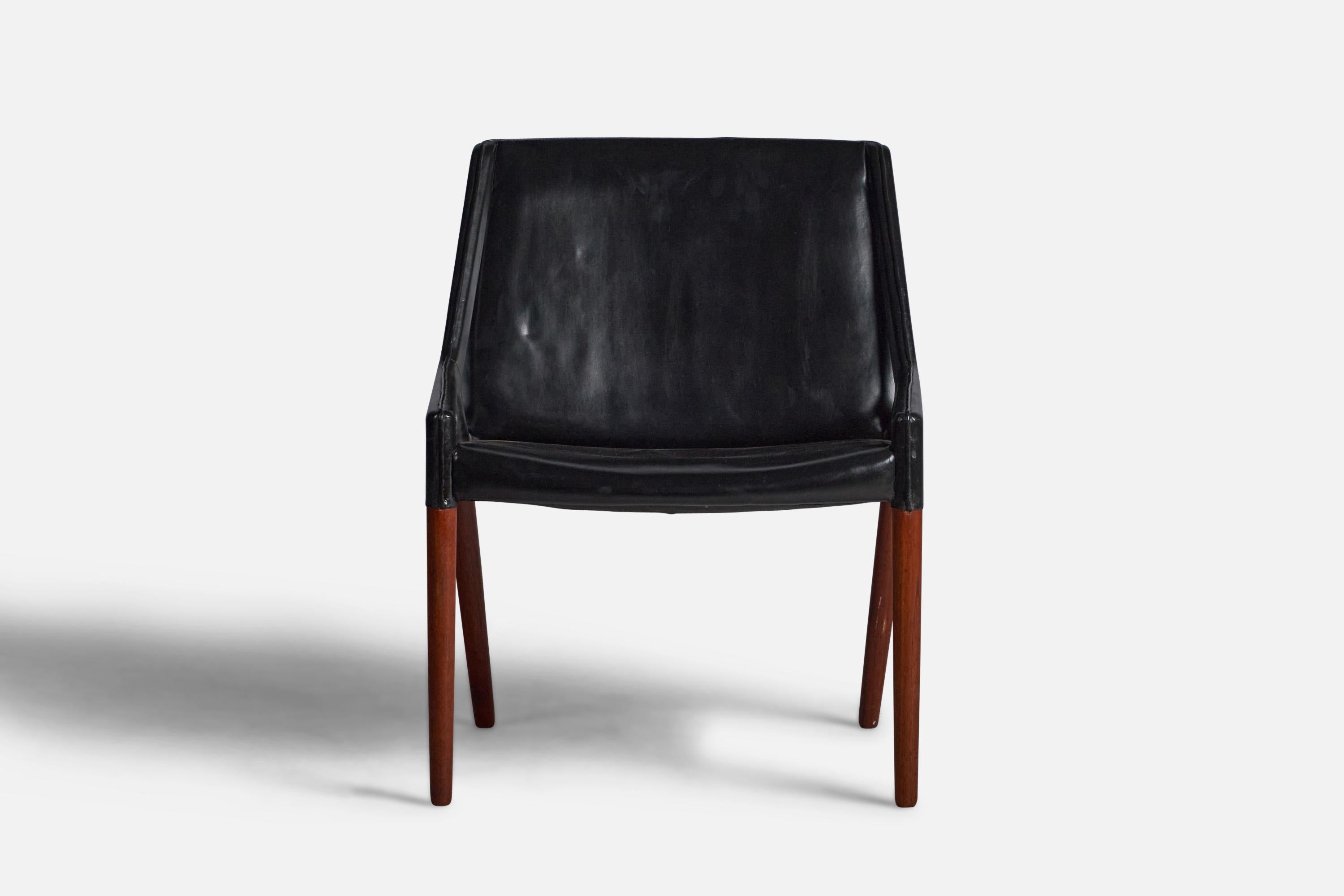A rare lounge chair designed by Ejner Larsen & Axel Bender Madsen, in a very rare execution with black leather. A prime example of the designers collaboration with the renowned cabinet maker Willy Beck, Copenhagen, Denmark. Bears manufacturers metal
