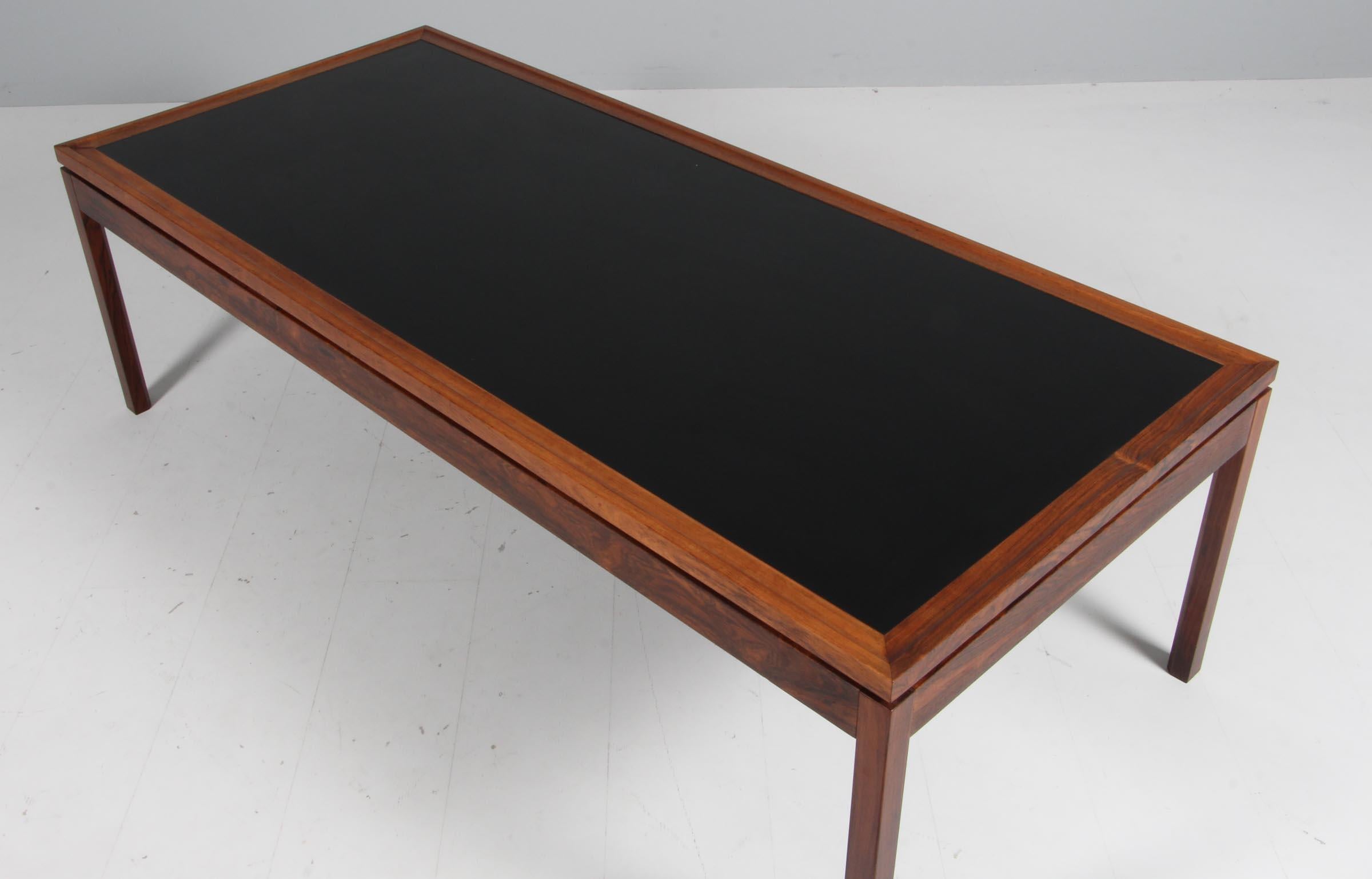 Ejvind A. Johansson coffee table in solid rosewood with formica top.