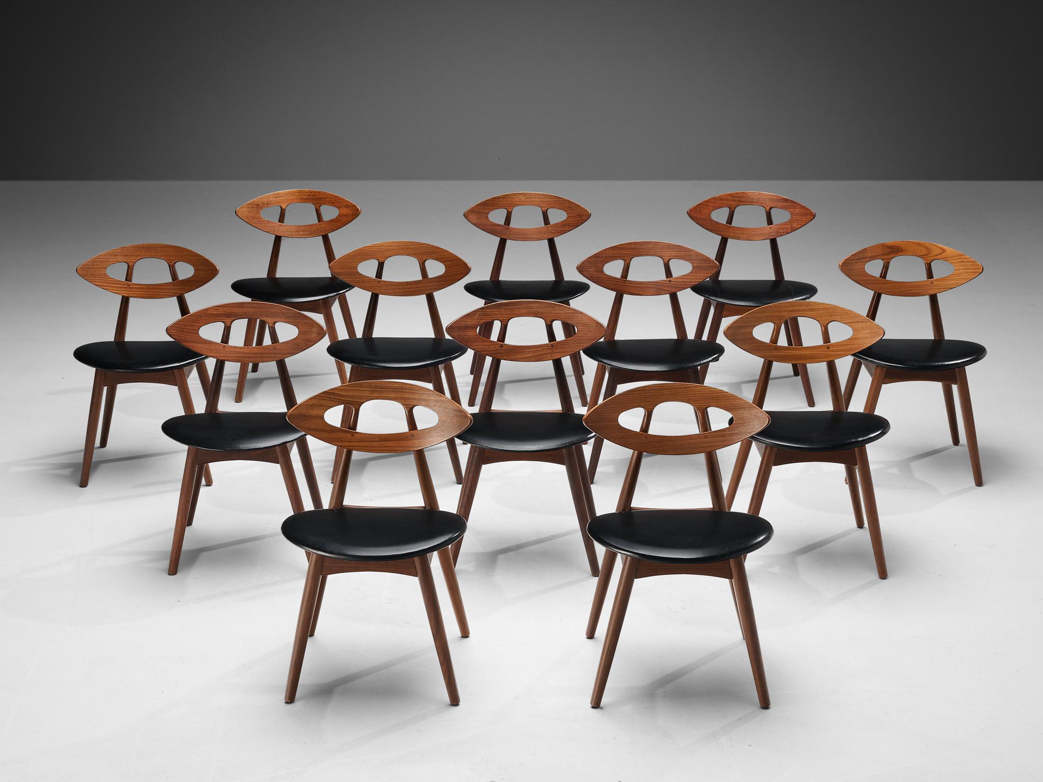 Ejvind A. Johansson for Ivan Gern Møbelfabrik, set of twelve dining chairs model 84 'eye', teak, black leatherette, Denmark, design 1961, production 1970s.

This wonderful and exclusive set of twelve ‘eye’ dining chairs by Danish designer Ejvind