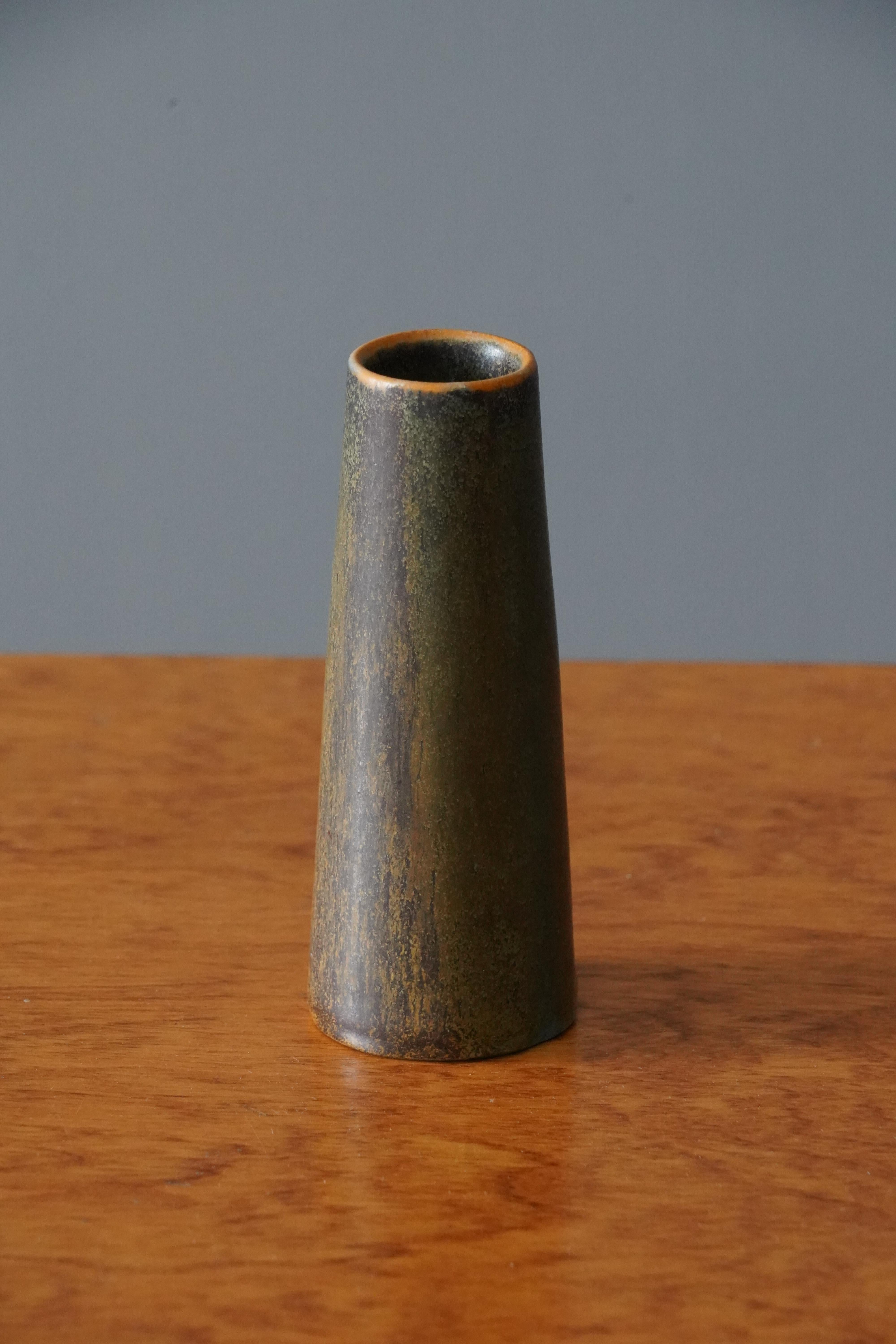 A small vase produced by Ejvind Nielsen in his studio in Hvidovre, Denmark. Produced circa 1950s-1960s. Signed.
 