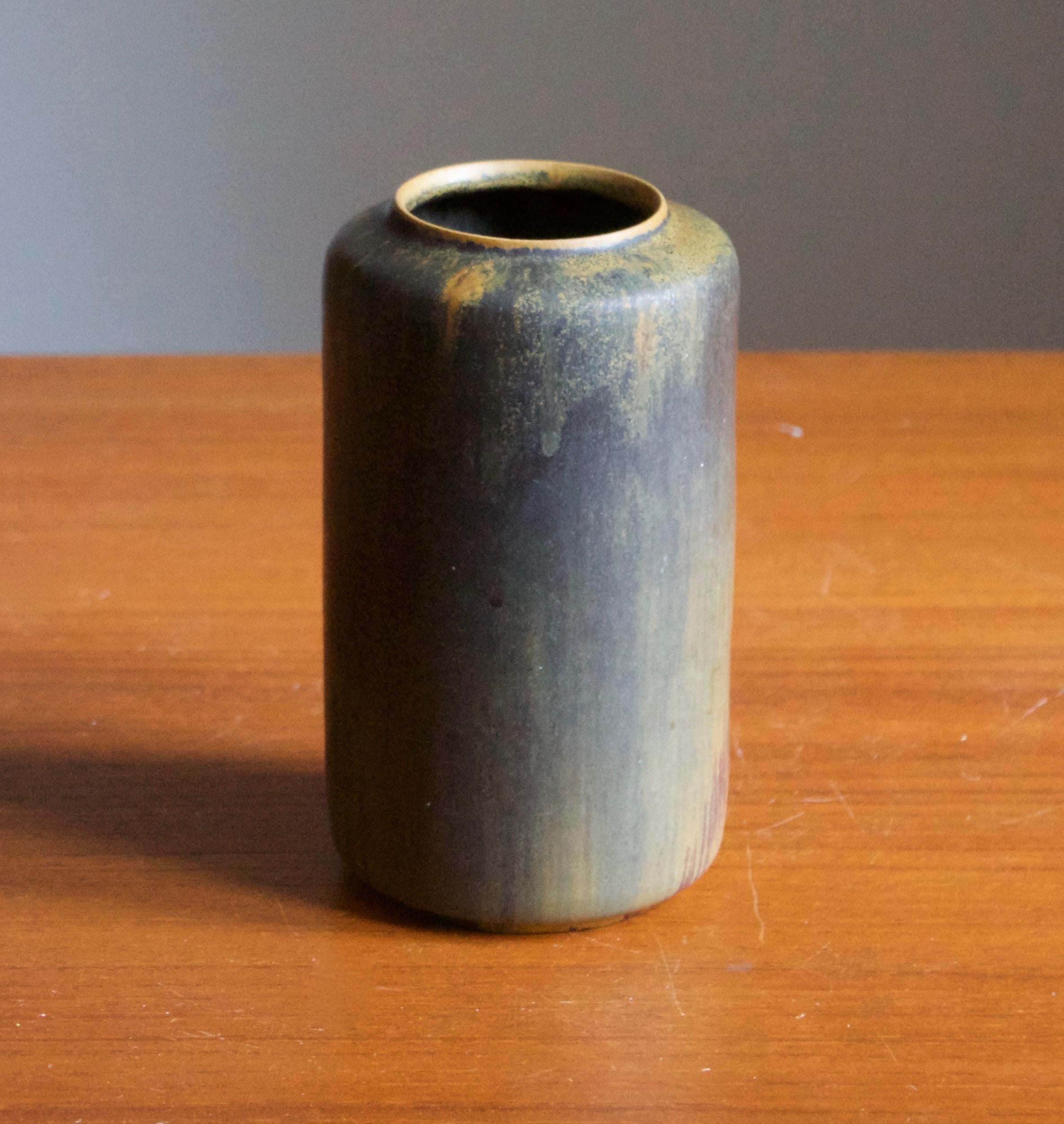 A vase produced by Ejvind Nielsen in his studio in Hvidovre, Denmark. Produced circa 1950s-1960s. Signed.