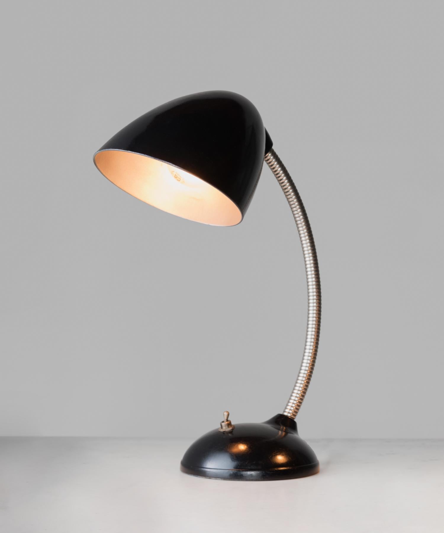 E.K. Cole desk lamp, England, circa 1930

Gooseneck Industrial desk lamp designed by Eric Kirkman Cole, with bakelite shade and base. typ 11.105 model.