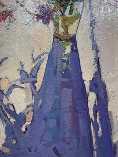 "Good Morning" purple flowers in a glass vase cast a shadow on the table, floral