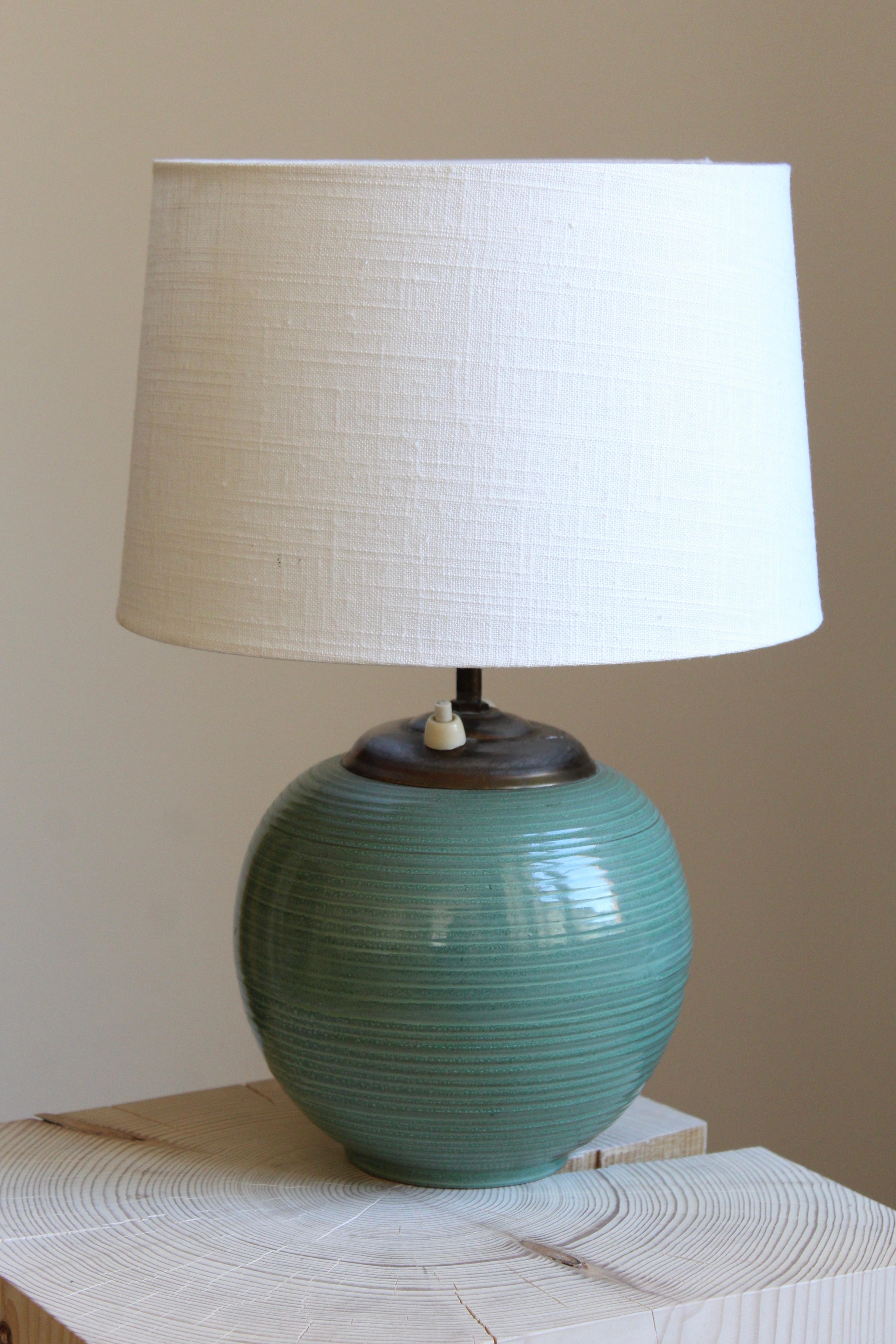 A table lamp by iconic Swedish ceramic firm Ekeby. In glazed stoneware. Marked. Sold without lampshade.

Other designers of the period include Axel Salto, Carl Harry Stålhane, Berndt Friberg, Lisa Larsson, and Wilhelm Kåge.