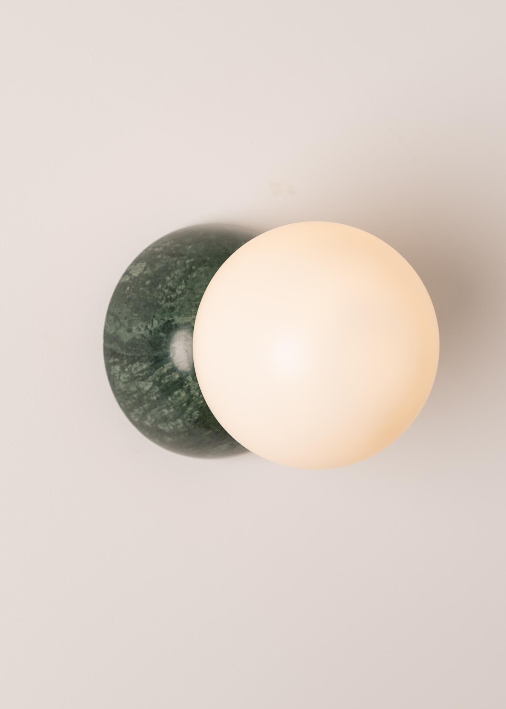 Eklipso Green Marble Wall Sconce by Simone & Marcel
Dimensions: D 19,5 x W 14 x H 14 cm.
Materials: Green marble and glass.

Available in different marble, brass, steel and alabaster options and finishes. Custom options available on request. Please