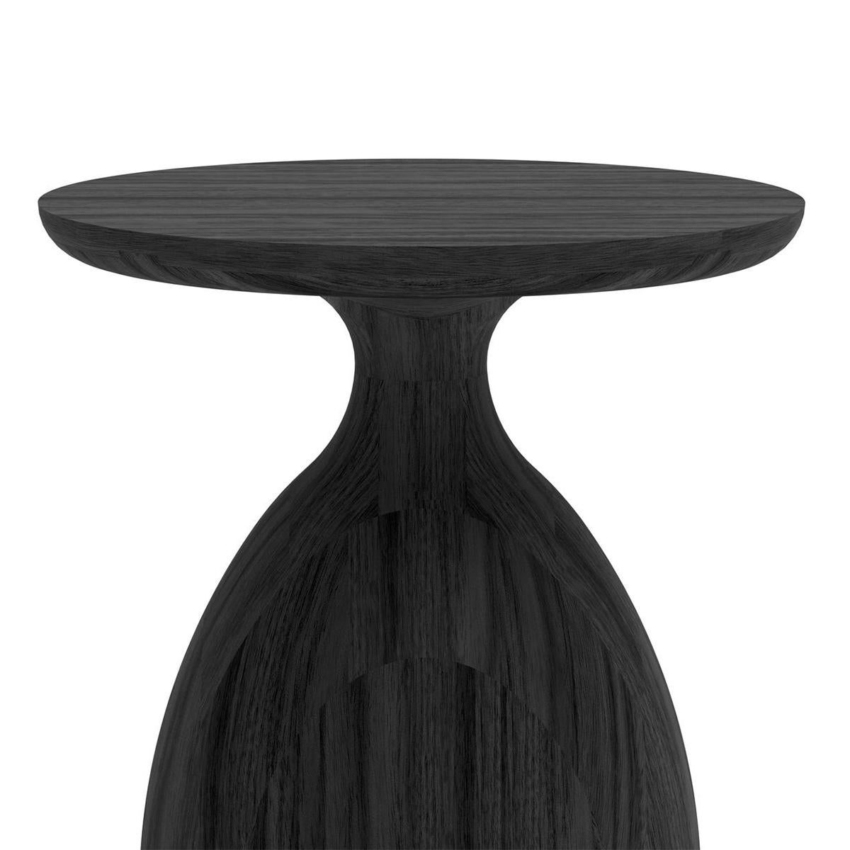 Side Table Eko Black Medium with all structure in
solid teak in black stained finish. Teak with water 
repellent treatment.