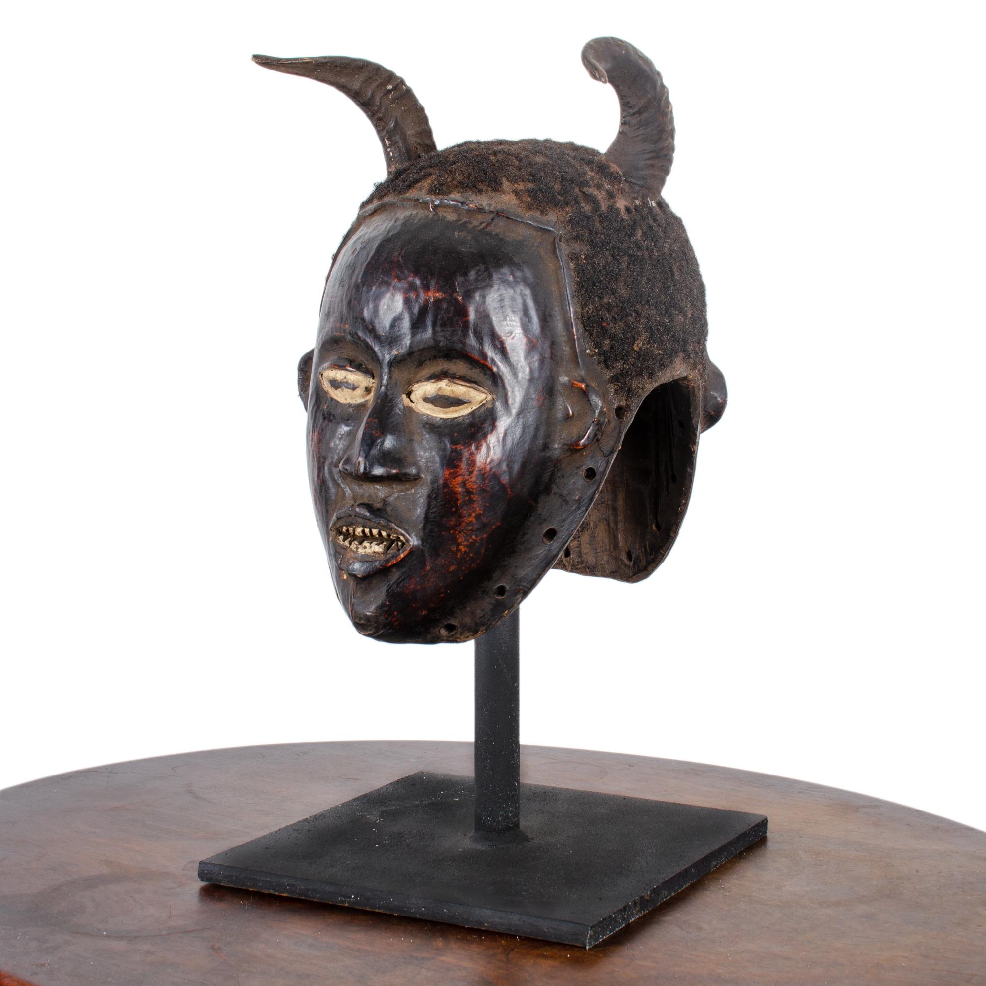 Janiform ceremonial headdress from the Ekoi, Ejagham people of the Cross River region of Southeastern Nigeria, circa early 20th century.  

The janus symbolism from the Cross River region suggests that the wearer can merge male and female attributes