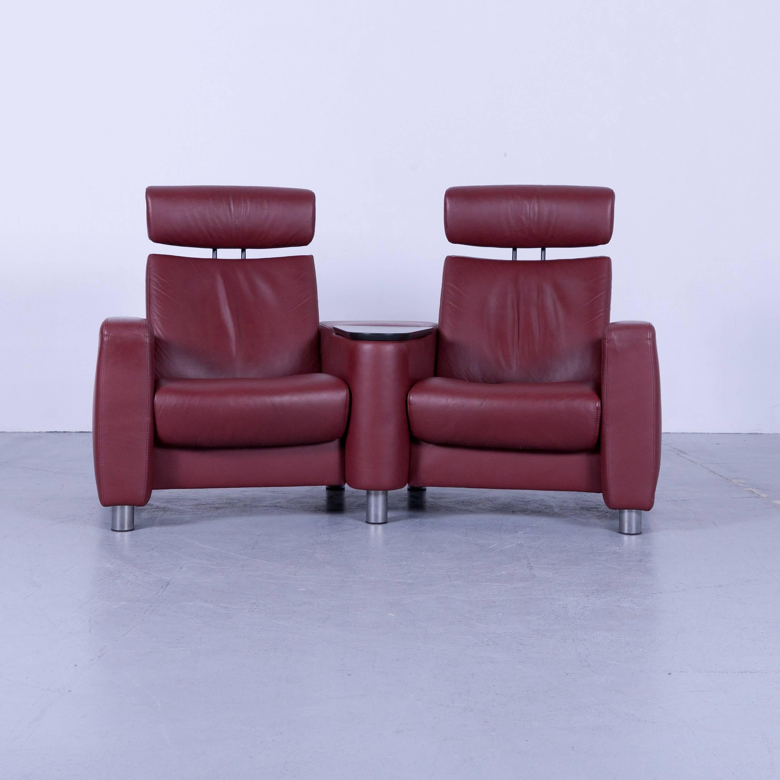 An Ekornes Stressless Arion leather cinema-sofa red recliner.




















  