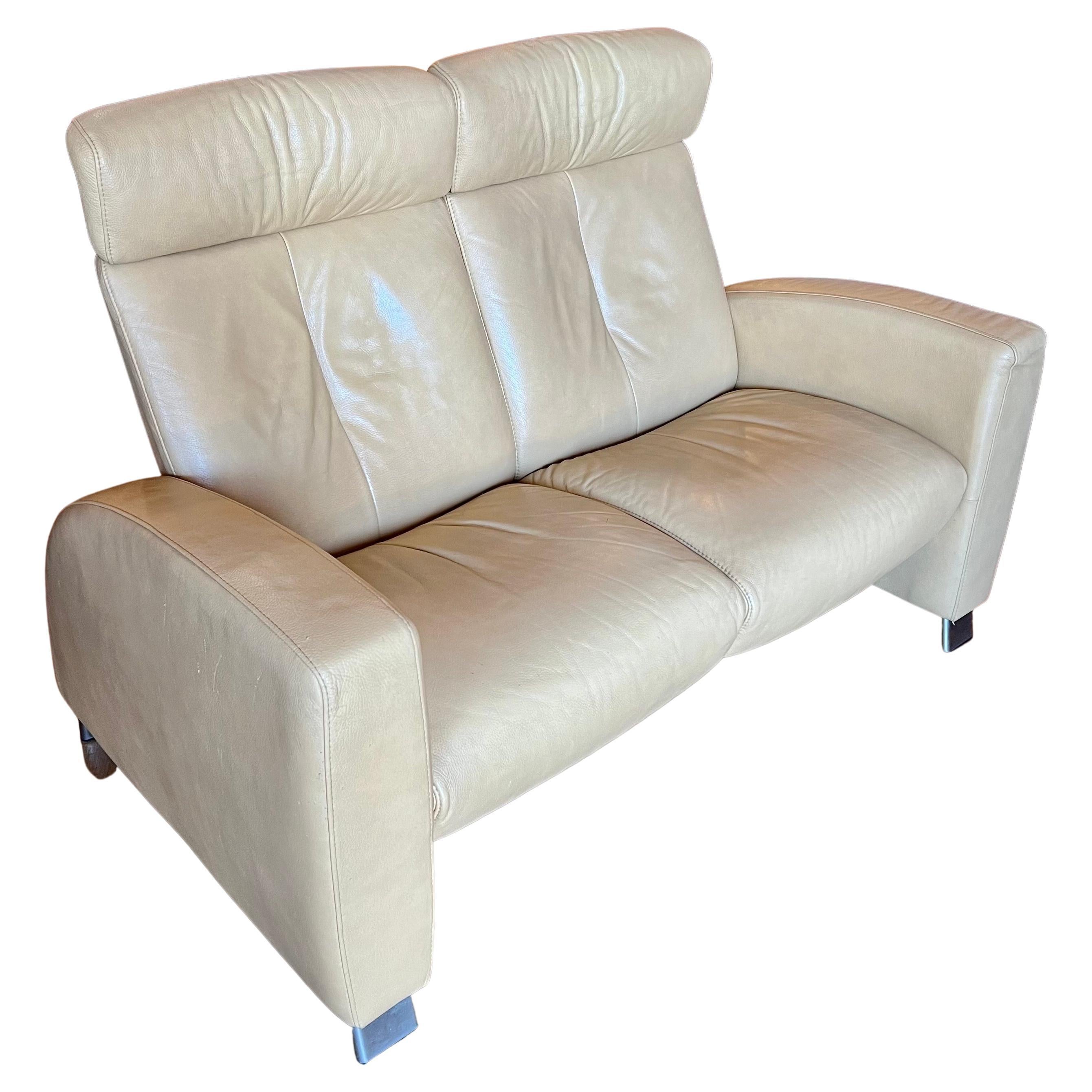 Striking tall back leather recliner circa 2002 in yellow cream color, nice and comfy beautiful lines out of production, Arion model light wear some scratches on the side as shown. Due to age and wear.
