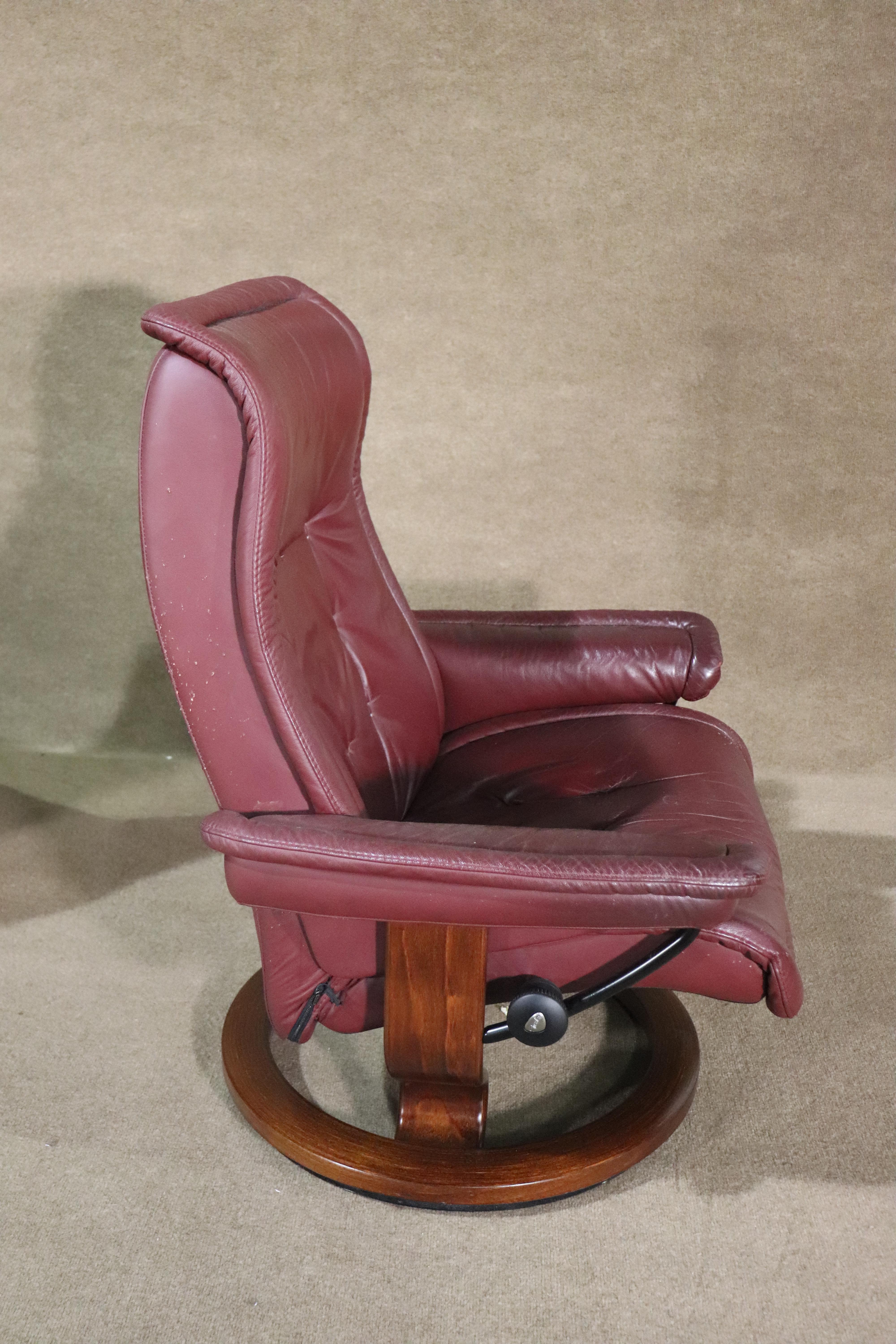 Vintage leather lounger with ottoman by Ekornes. Features soft maroon colored leather on a polished bentwood base.
Listing is for one.
Please confirm location NY or NJ