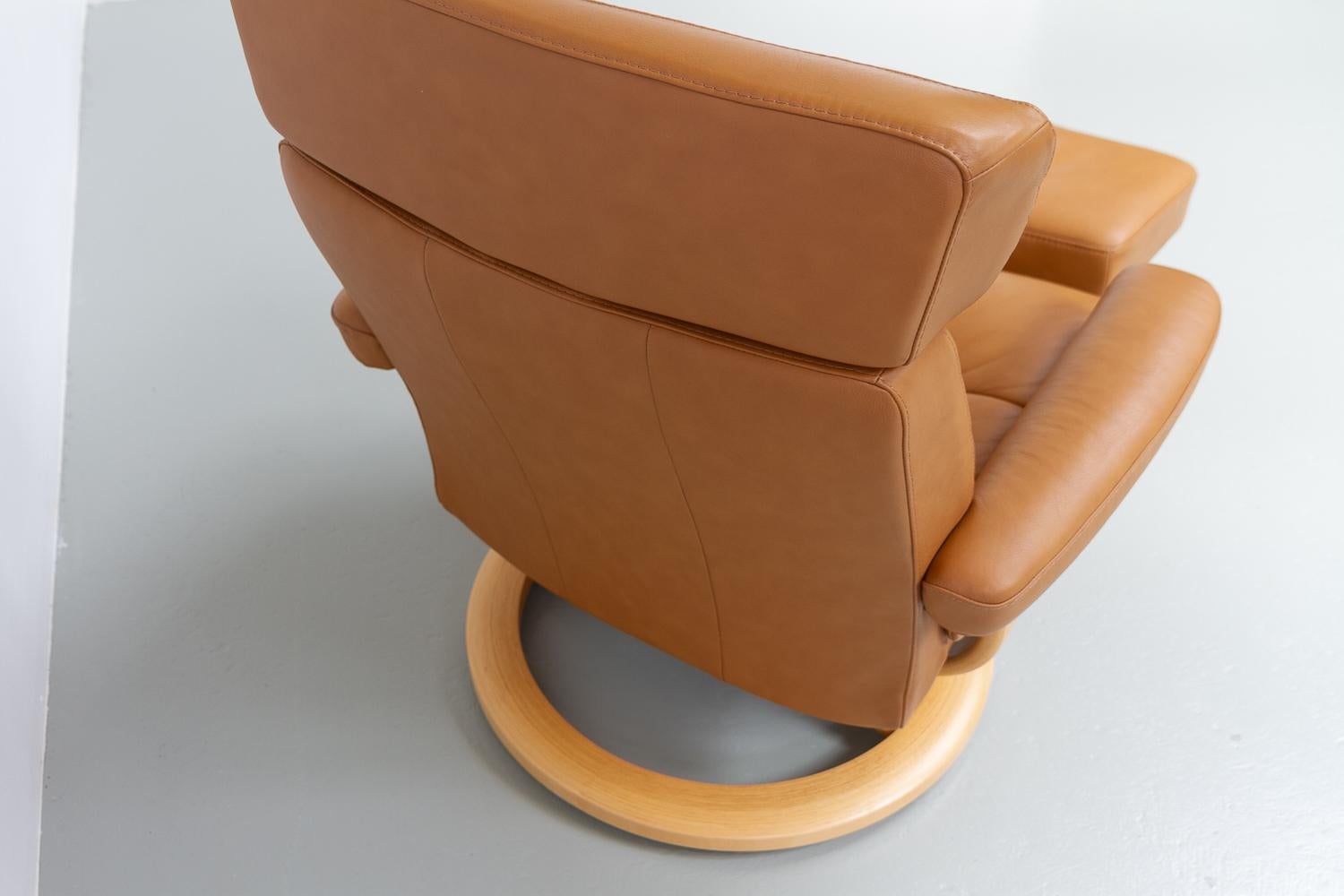 Contemporary Ekornes Stressless Reclining Lounge Chair and Ottoman, 2000s.