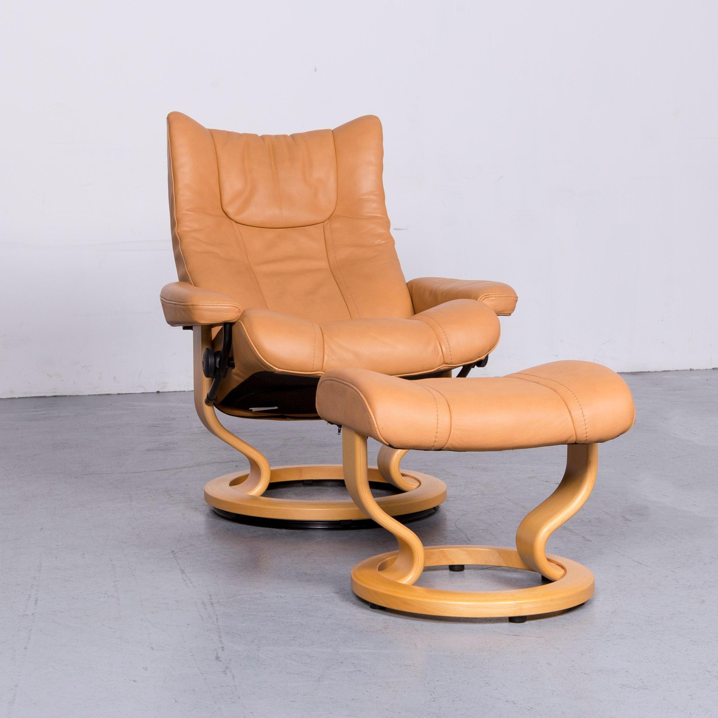 We bring to you an Ekornes Stressless wing armchair and footstool beige leather recliner chair.