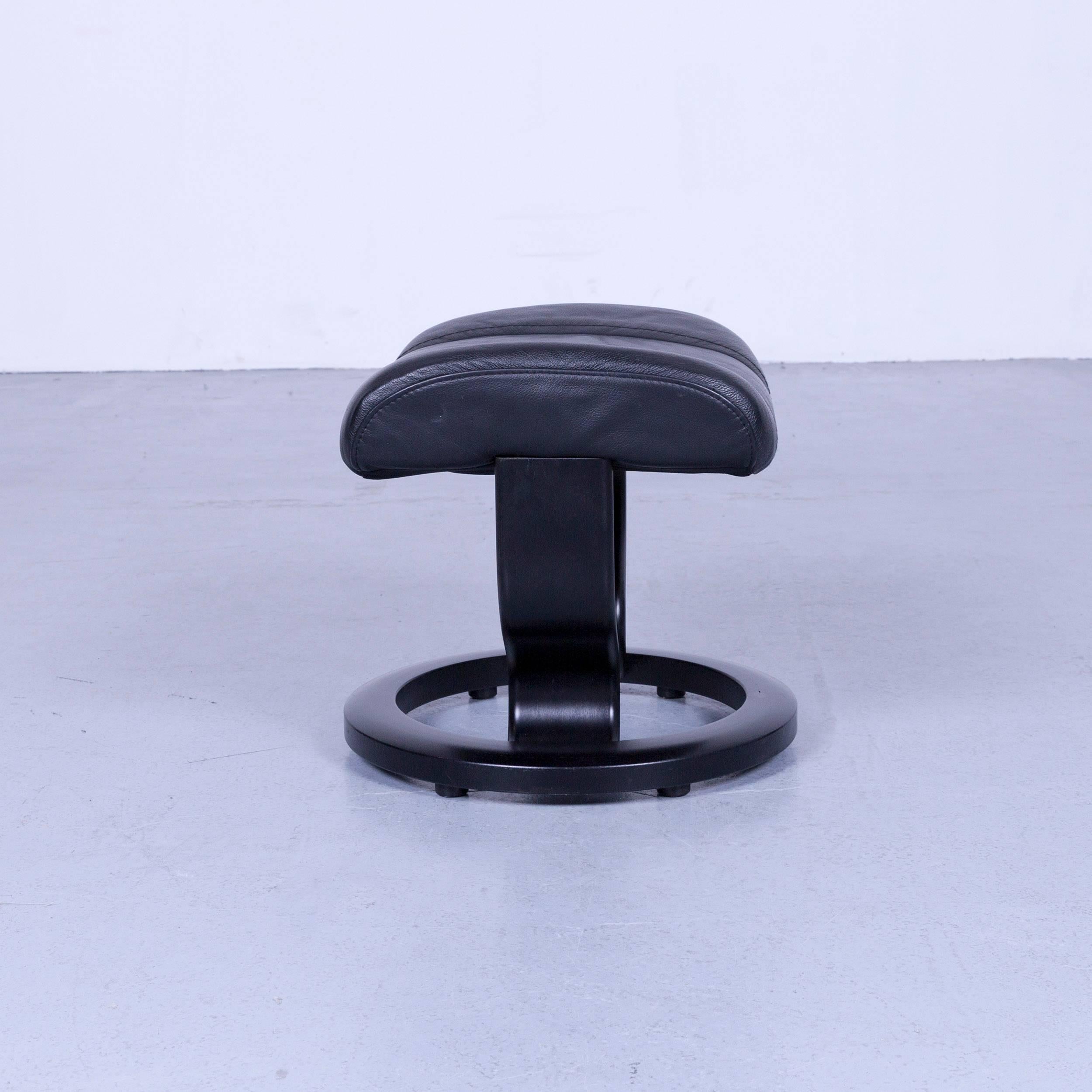 Ekornes Stressless wing footstool black leather modern footrest designer wood, made for pure comfort and flexibility.