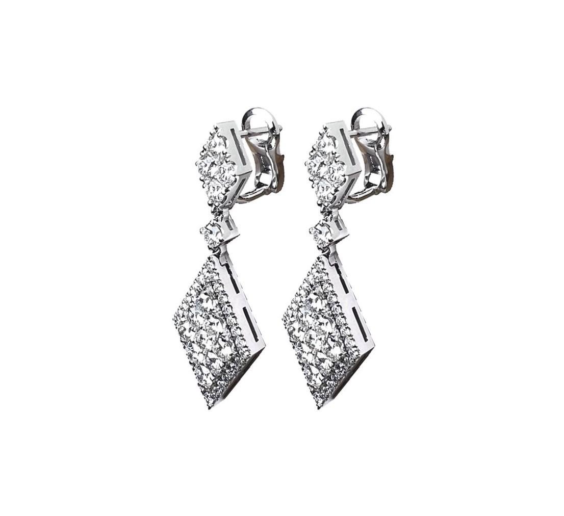 Ekos Gem 14K White Gold 3.58ct TW Diamonds Dangle Pendant Earrings.
  
Elevate your elegance with our exquisite 14 Carat White Gold and Diamonds Dangle Pendant Diamond-Shaped Earrings. These stunning earrings blend timeless sophistication with
