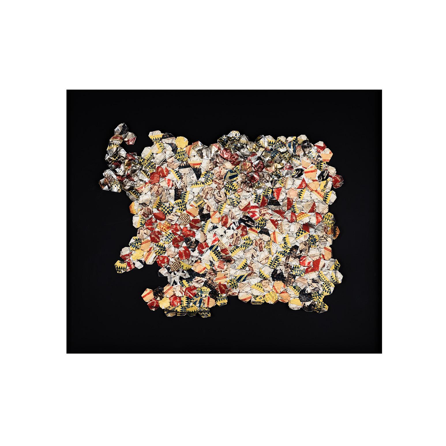 El Anatsui (b. 1944) is an acclaimed Ghanian sculptor working out of Nigeria. Known for his large-scale tapestry-like metallic sculptures created from discarded resources, Anatsui draws meaningful connections between consumption, waste, and the