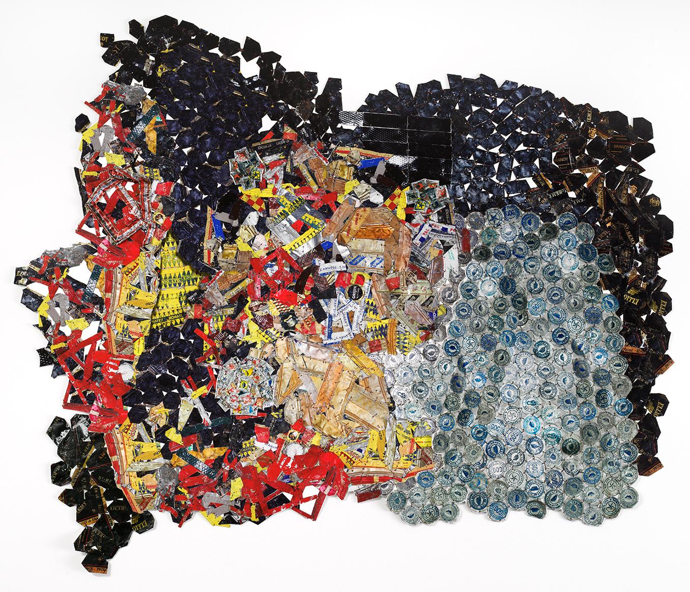 El Anatsui uses typically discarded resources such as liquor bottle caps, cassava graters and newspaper printing plates, to create both floor-based sculptures and shimmering wall pieces that sway and flex like cloth and that defy any categorisation.