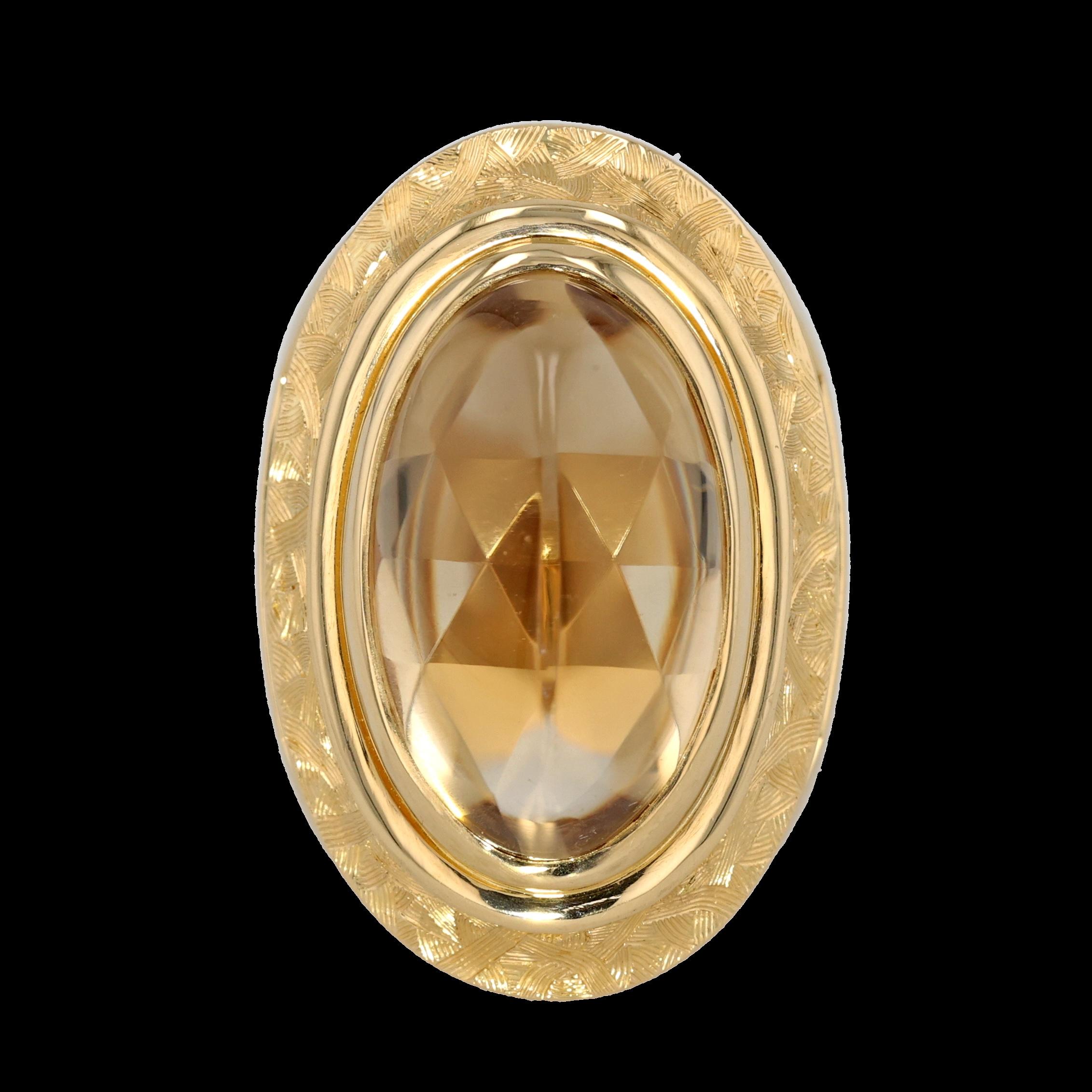 Immerse yourself in the opulent elegance of the El Dorado Hand Engraved Ring, an extraordinary creation by the illustrious designer Michael Bondanza. This stunning ring features a magnificent 18.24-carat oval light citrine, whose ethereal golden hue