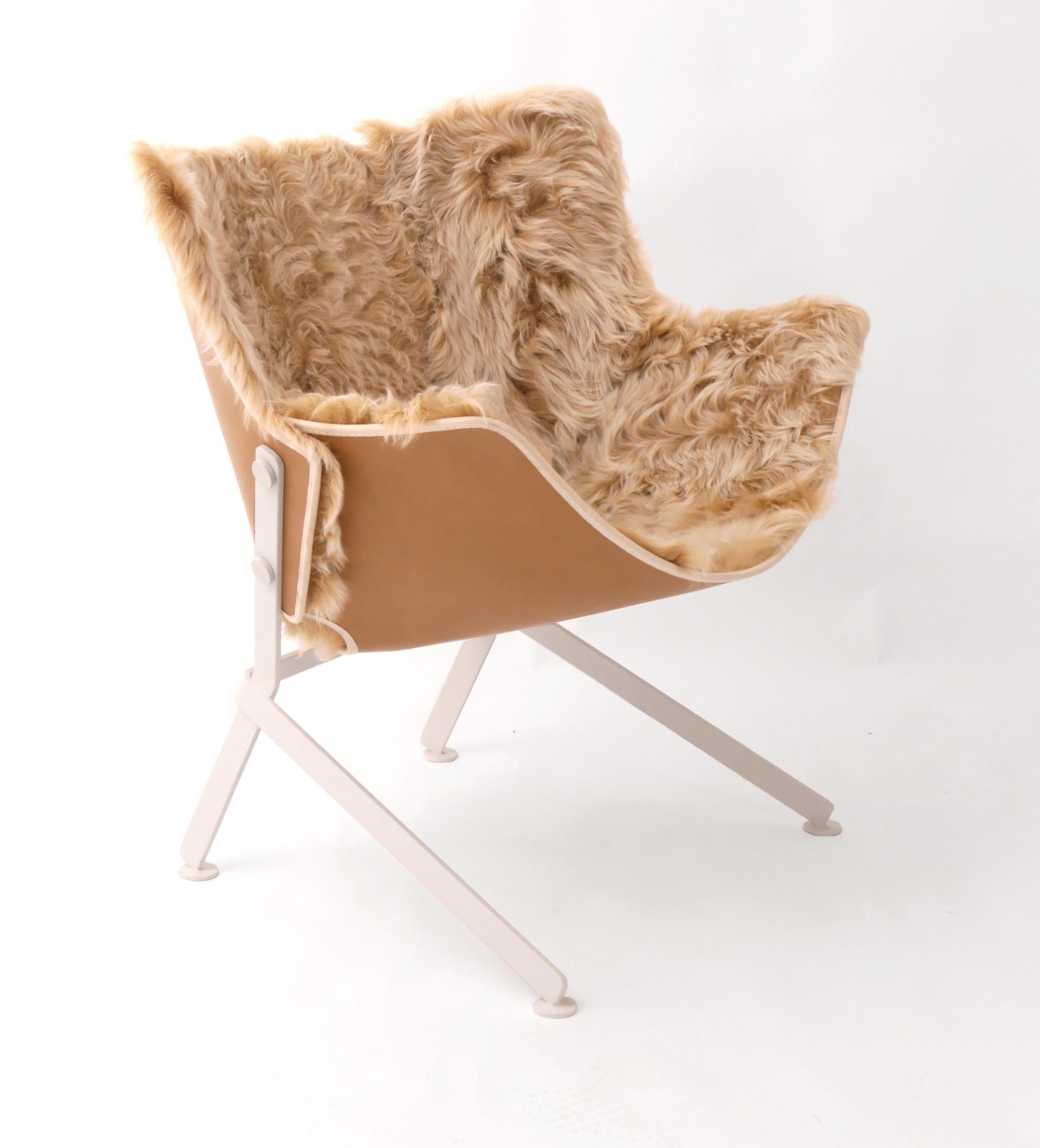 Designed by Christophe de la Fontaine, this piece is structured in powder-coat painted steel. The seat is offered in a variety of standard fur color options, and can also be produced in leathers, kilim or Mongolian fur.