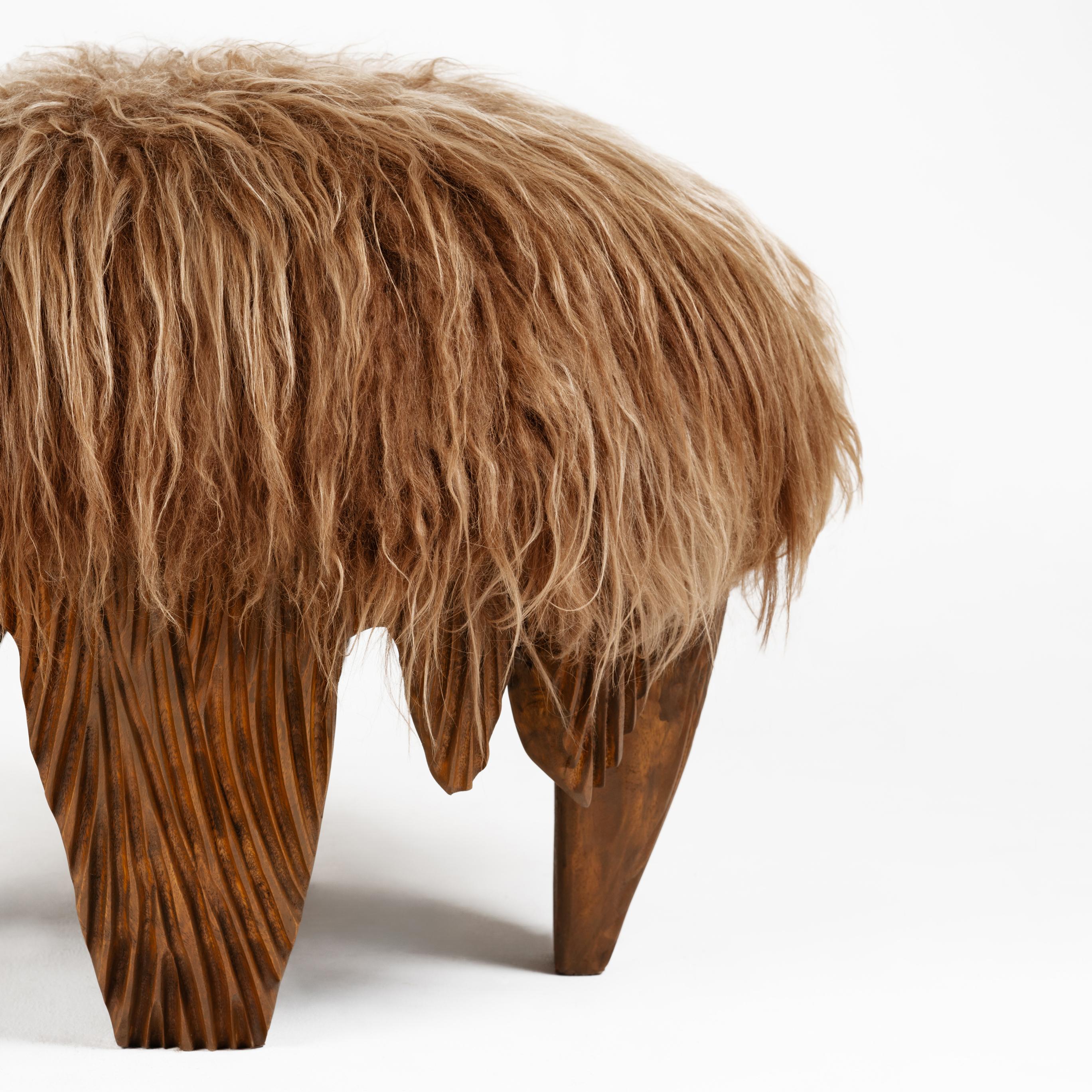 A tactile piece of domestic fantasy, the El Topo ottoman is a social object, featuring a carved Acacia base, burnt using the traditional method of Shou Sugi Ban and an animalistic, yet luxuriously soft, caramel Icelandic sheepskin top.

PRODUCT