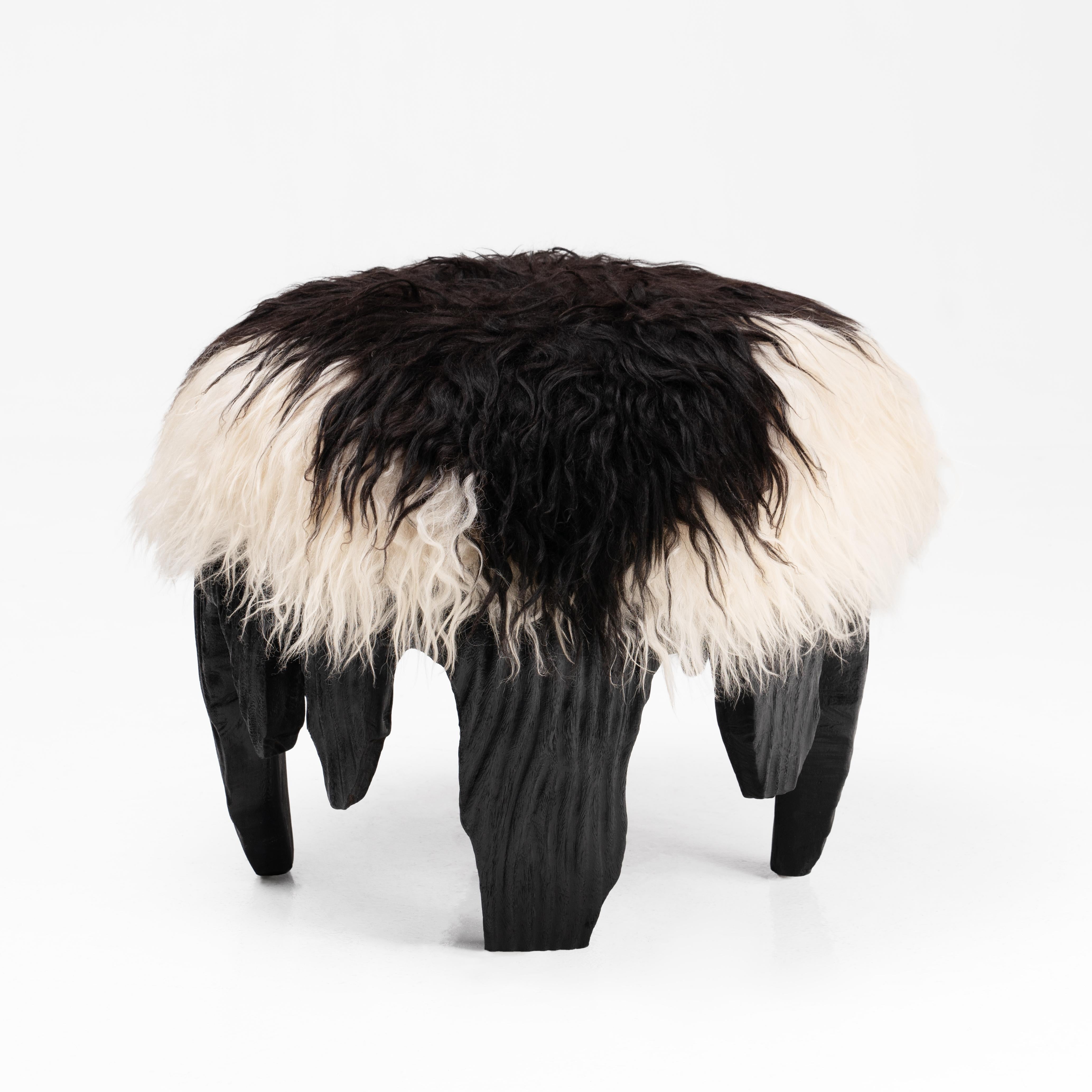 El Topo Ottoman by Odditi
Dimensions: ⌀ 60 x H 40 cm
Materials: Acacia Base, Sheepskin

A tactile piece of domestic fantasy, the El Topo ottoman is a social object, featuring a carved Acacia base, burnt using the traditional method of Shou Sugi Ban